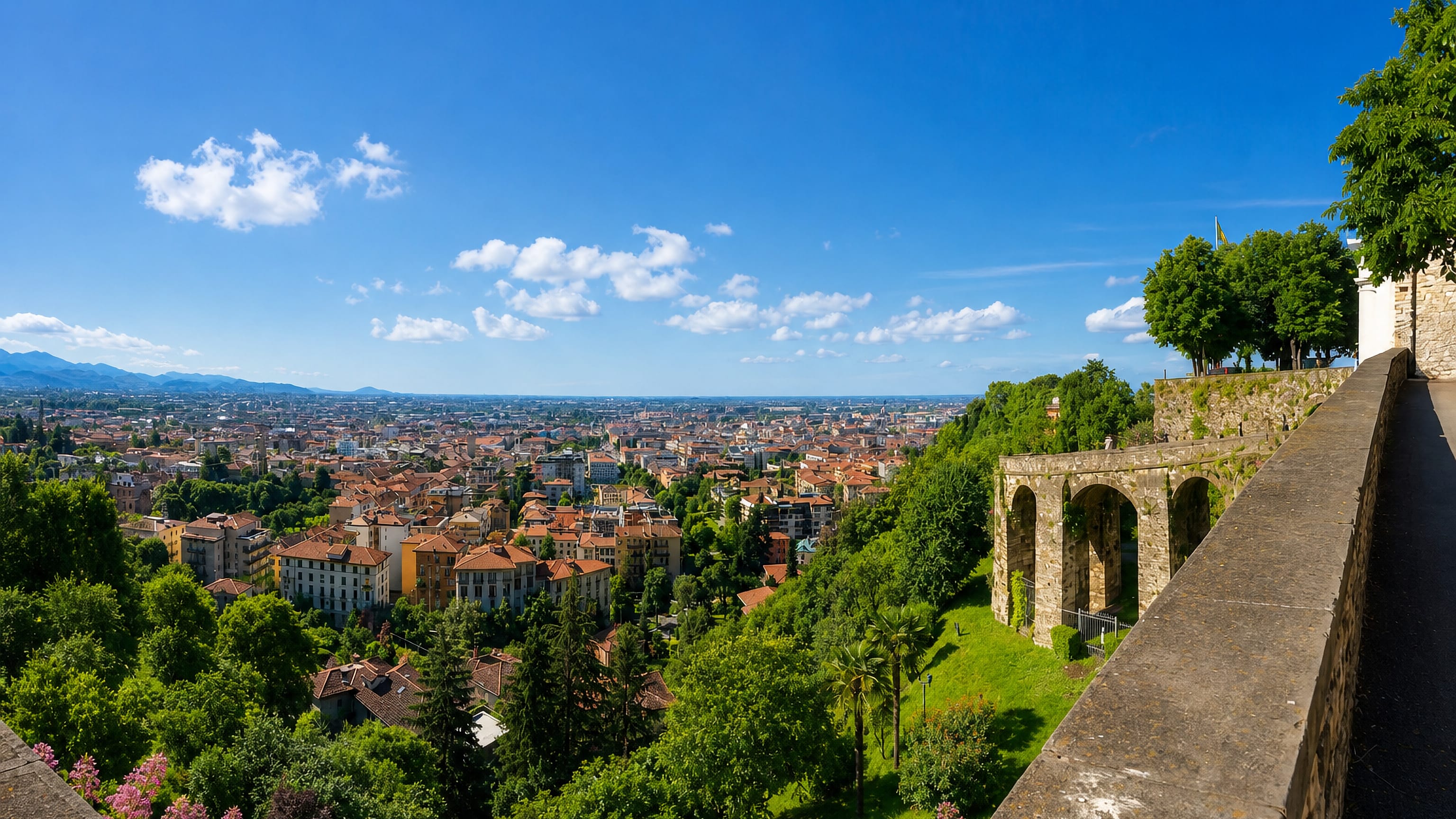 Bergamo's Venetian walls in Città Alta overlooking the terracotta rooftops of the lower town and the Lombard plain