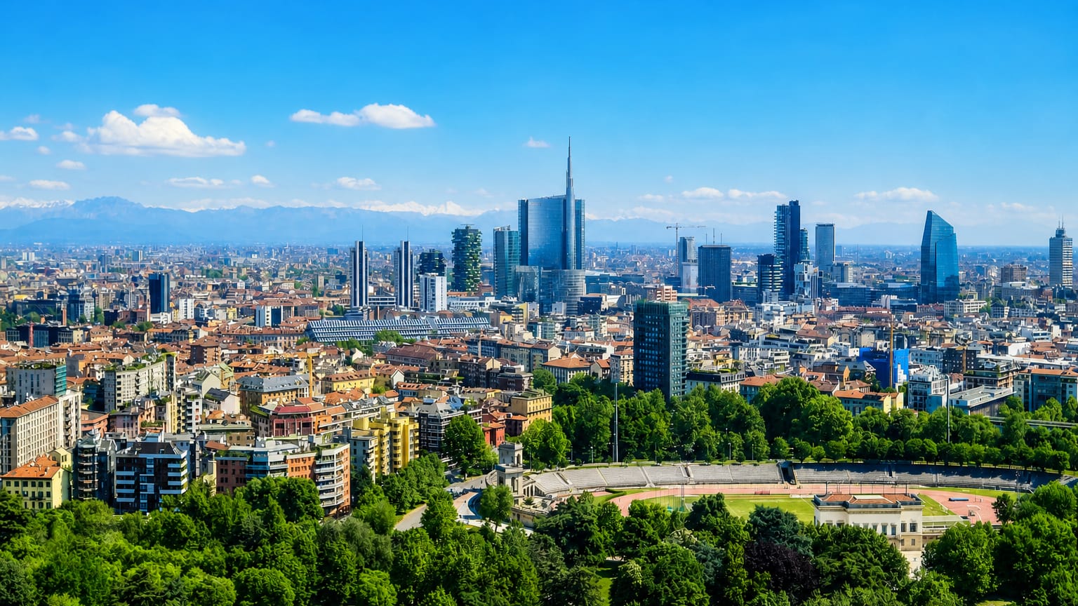 Milan's Porta Nuova skyline with the UniCredit Tower and Bosco Verticale, snow-capped Alps beyond and the Arena Civica below.