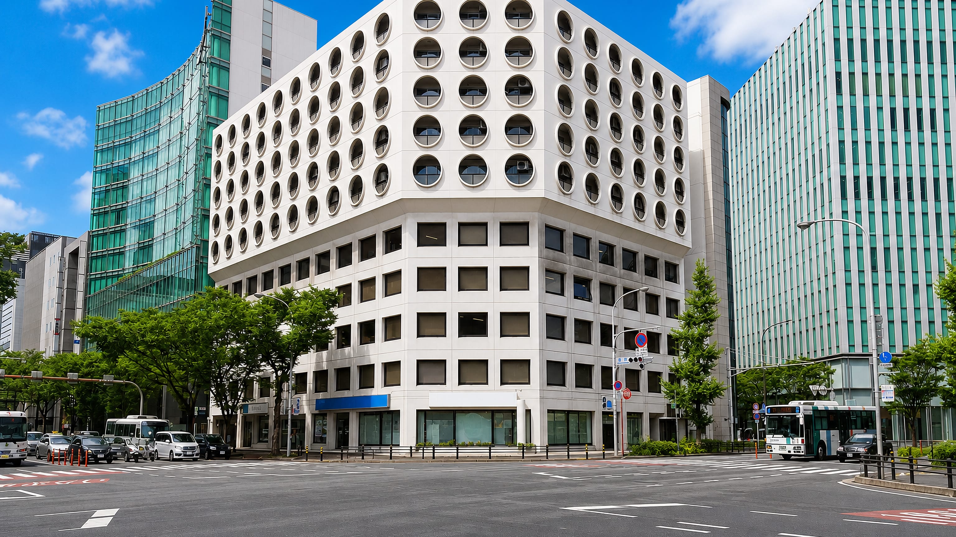 Modern office blocks at a wide street corner in Hakata-eki-higashi, the business quarter east of Hakata Station, Fukuoka.