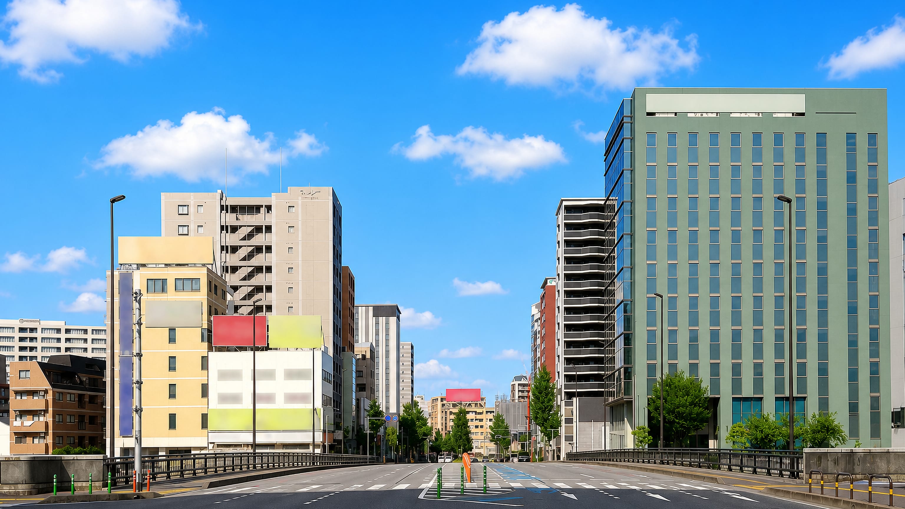 Wide sunny boulevard lined with mid-rise offices and apartments in Sumiyoshi, Fukuoka.