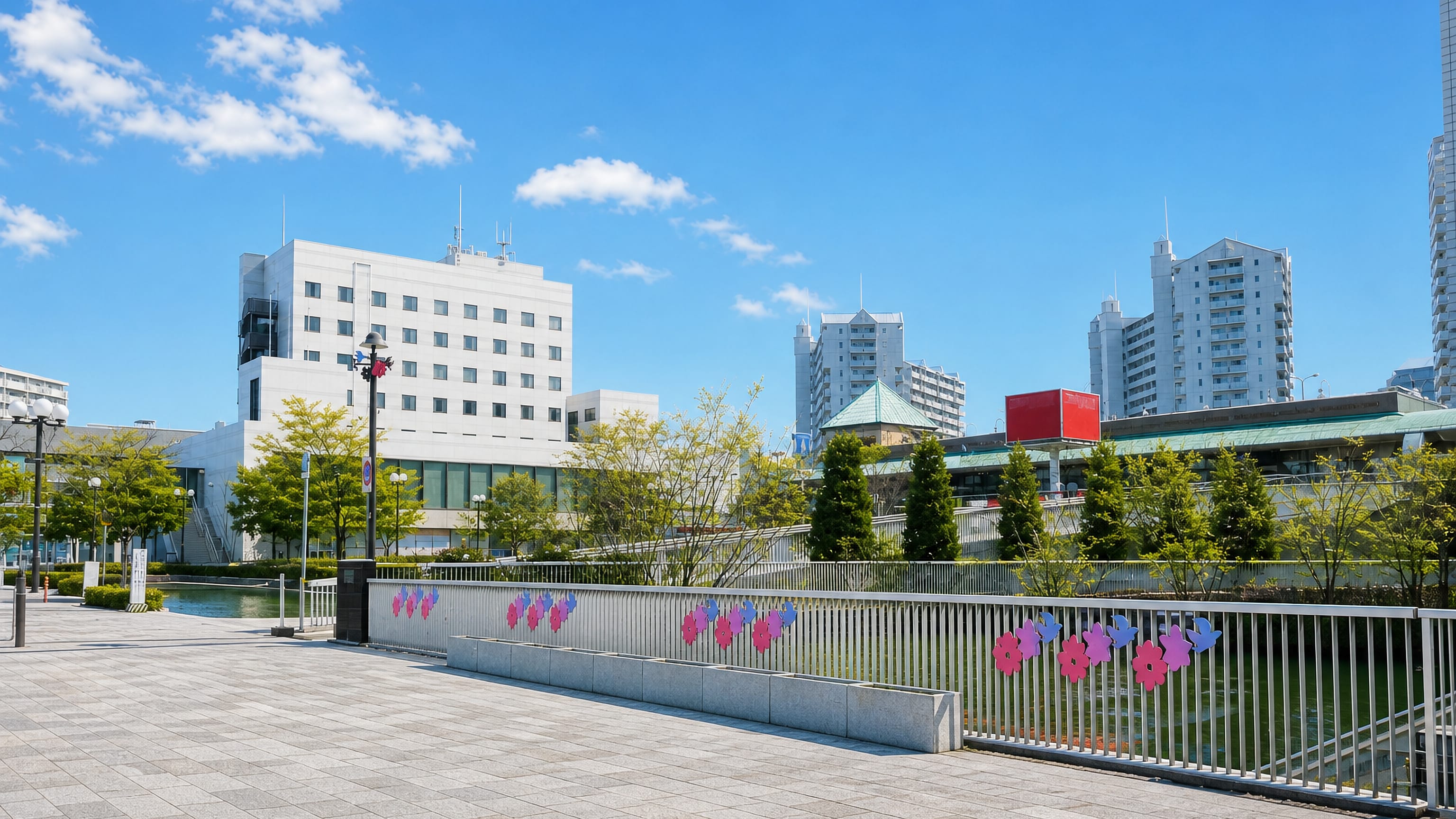 Modern plaza, waterway and apartment towers in the town centre of Sanda, Hyōgo Prefecture, Japan
