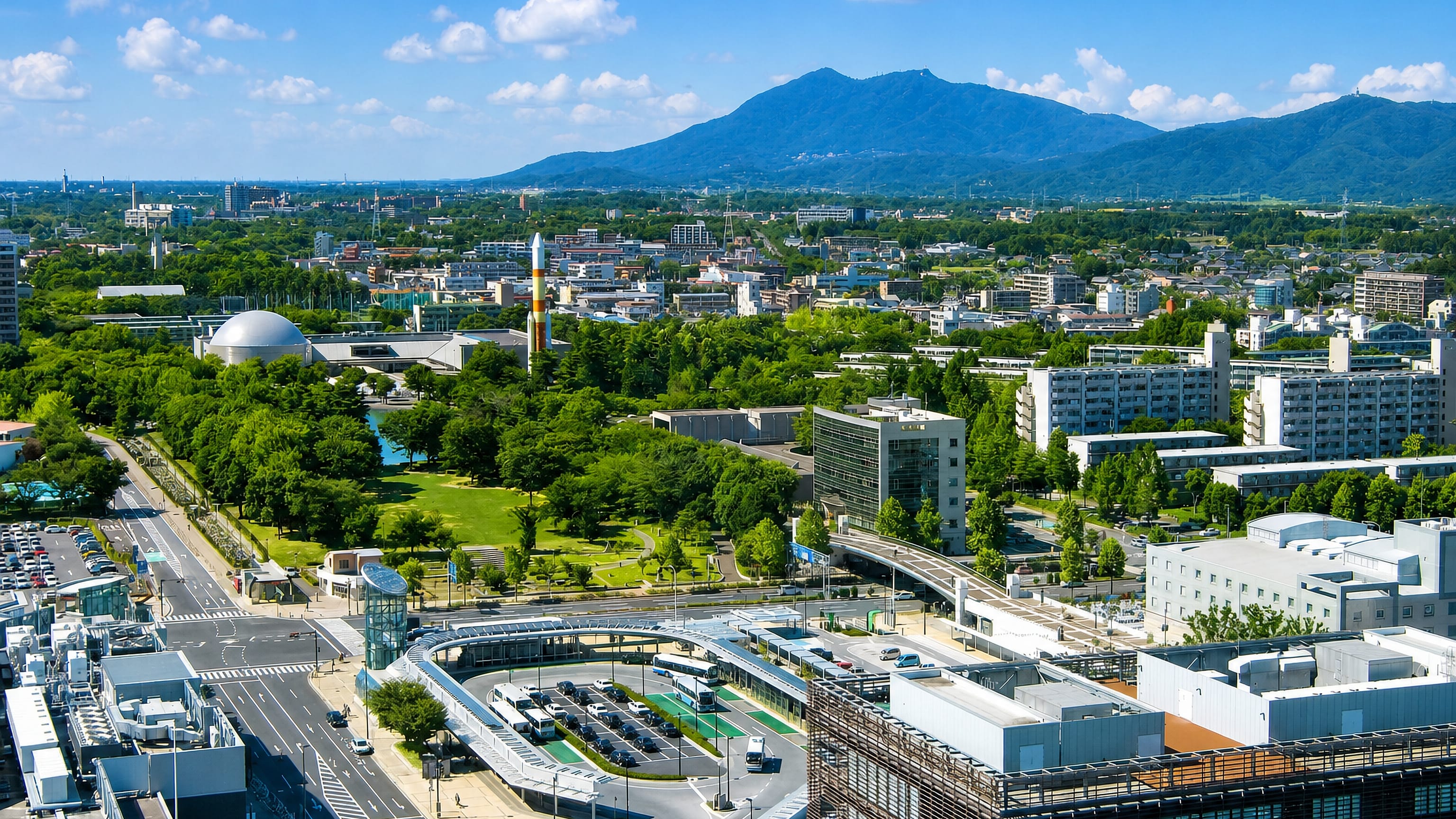 Tsukuba, Japan, with its Expo Center rocket and planetarium dome below twin-peaked Mount Tsukuba.