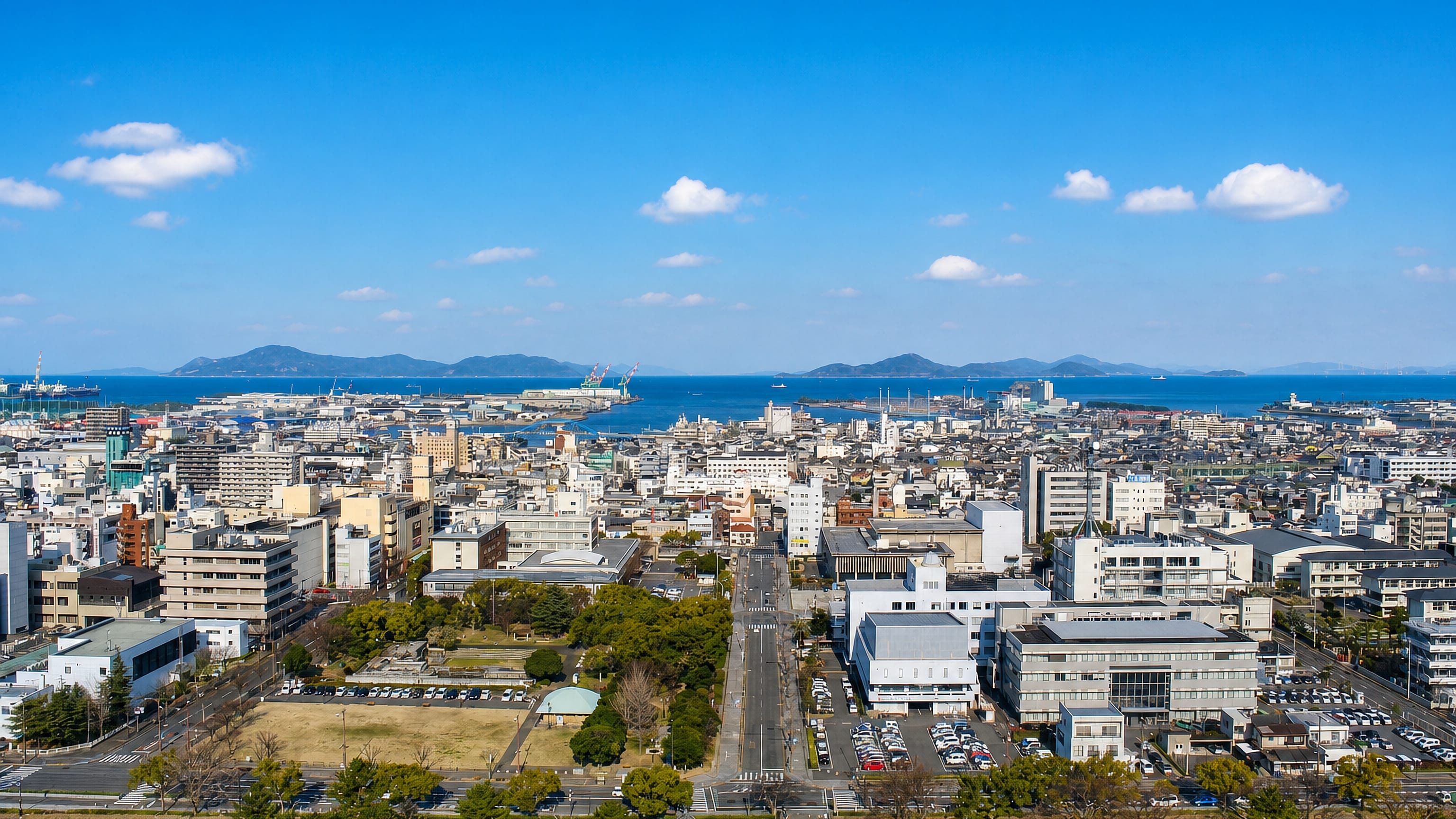 Marugame, Kagawa, seen from the castle hill, its grid of streets reaching the Seto Inland Sea and islands