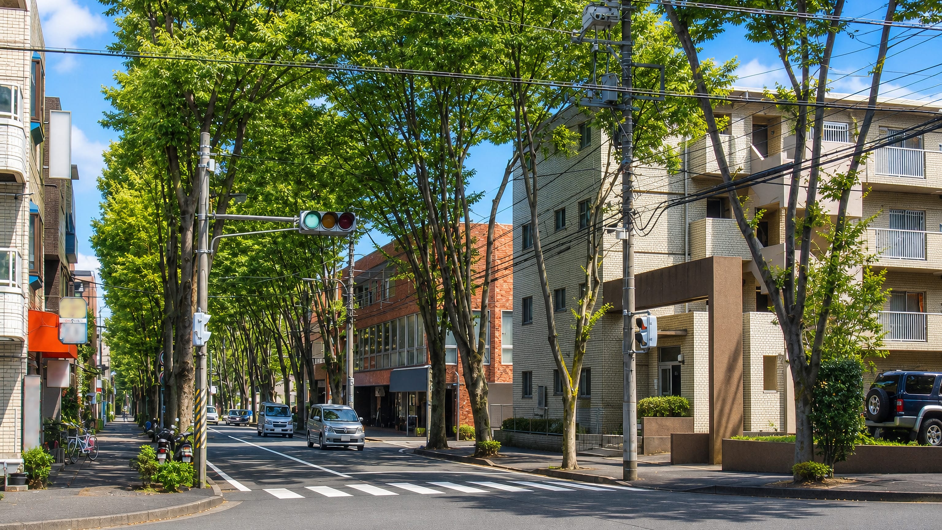 Tree-lined residential street with low apartment blocks in Aoba-ku, Yokohama, Japan.