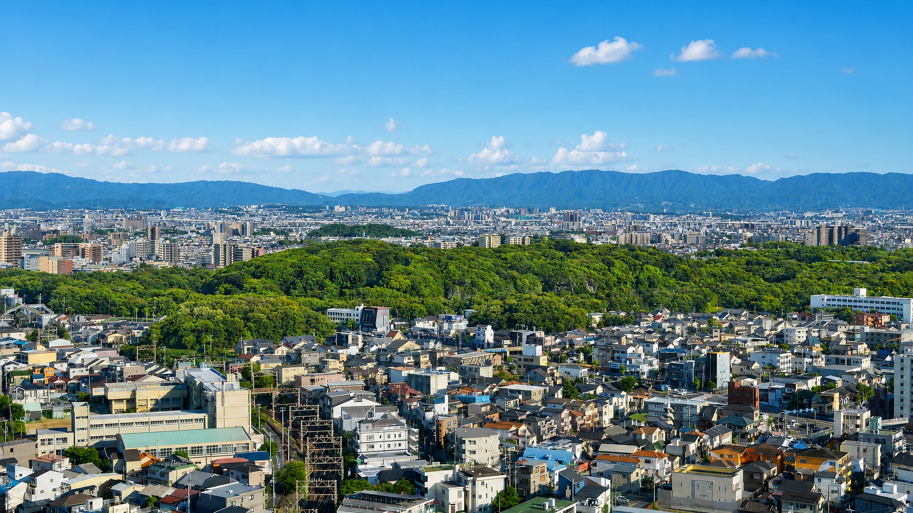 Sakai, Japan, with the wooded Mozu burial mound rising above dense low-rise housing and the Osaka plain.