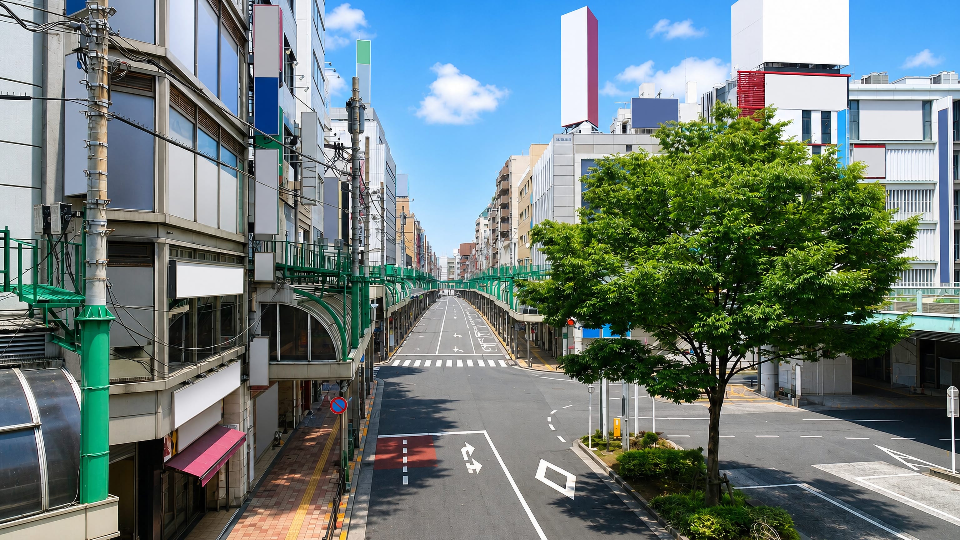 Wide shopping street lined with mixed low-rise buildings and a green pedestrian deck in Senju, Tokyo.