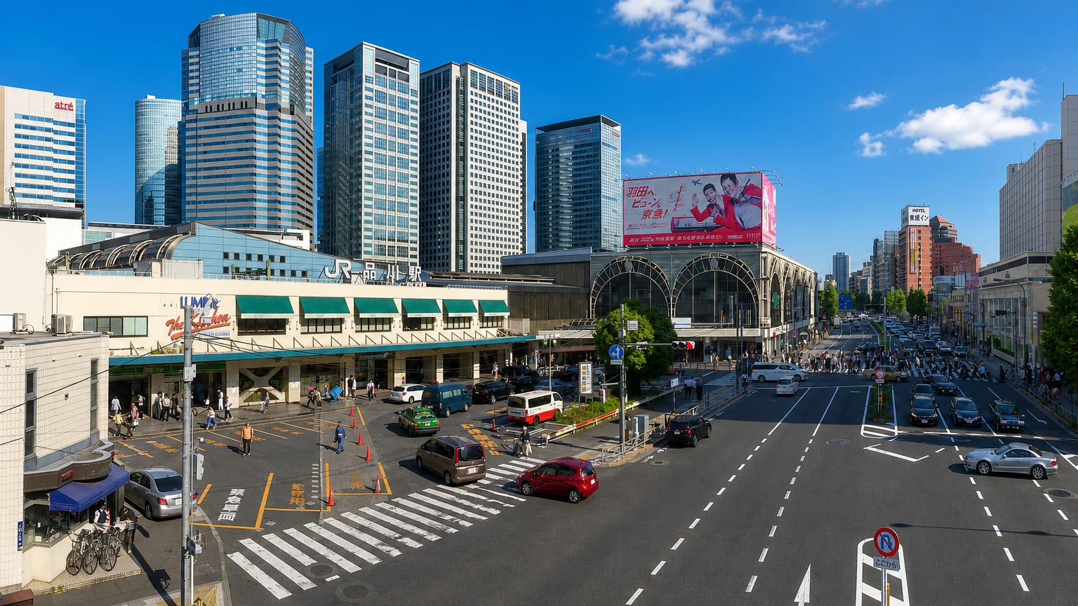 JR Shinagawa Station plaza in Tokyo with the LUMINE building and glass office towers behind.