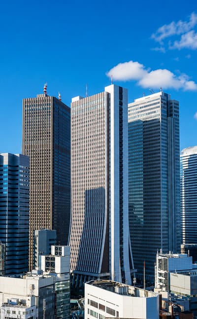 Aerial view of Shinjuku's skyscraper district in Tokyo including the twin-towered Metropolitan Government Building