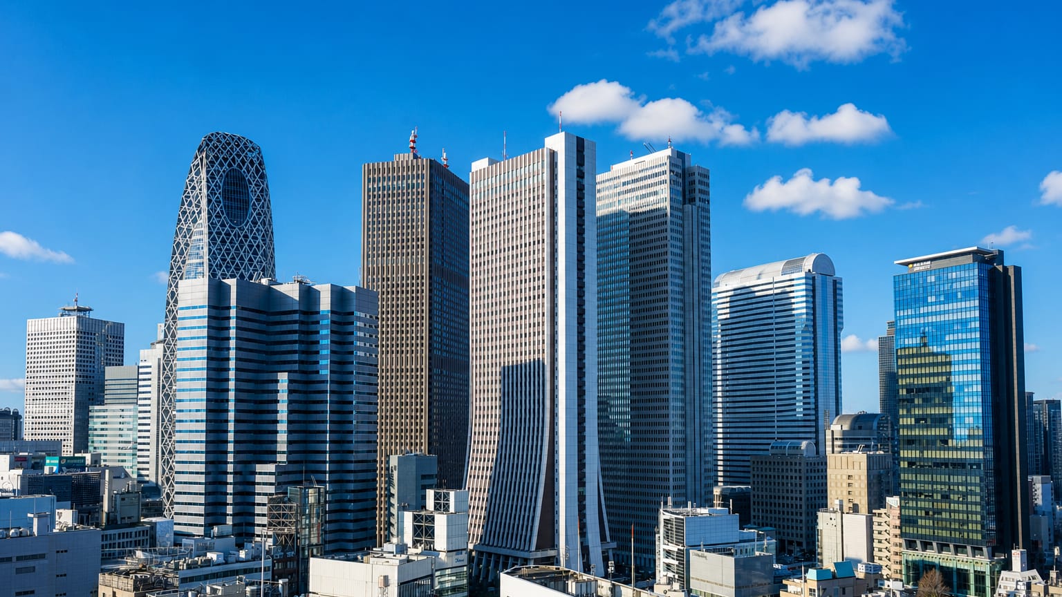 Aerial view of Shinjuku's skyscraper district in Tokyo including the twin-towered Metropolitan Government Building