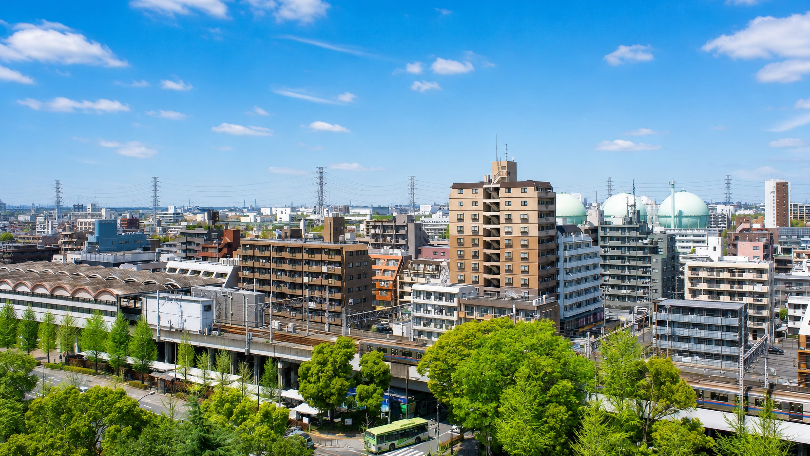 Apartment blocks, an elevated railway and gas holders make up the townscape of Takashimadaira, Tokyo.