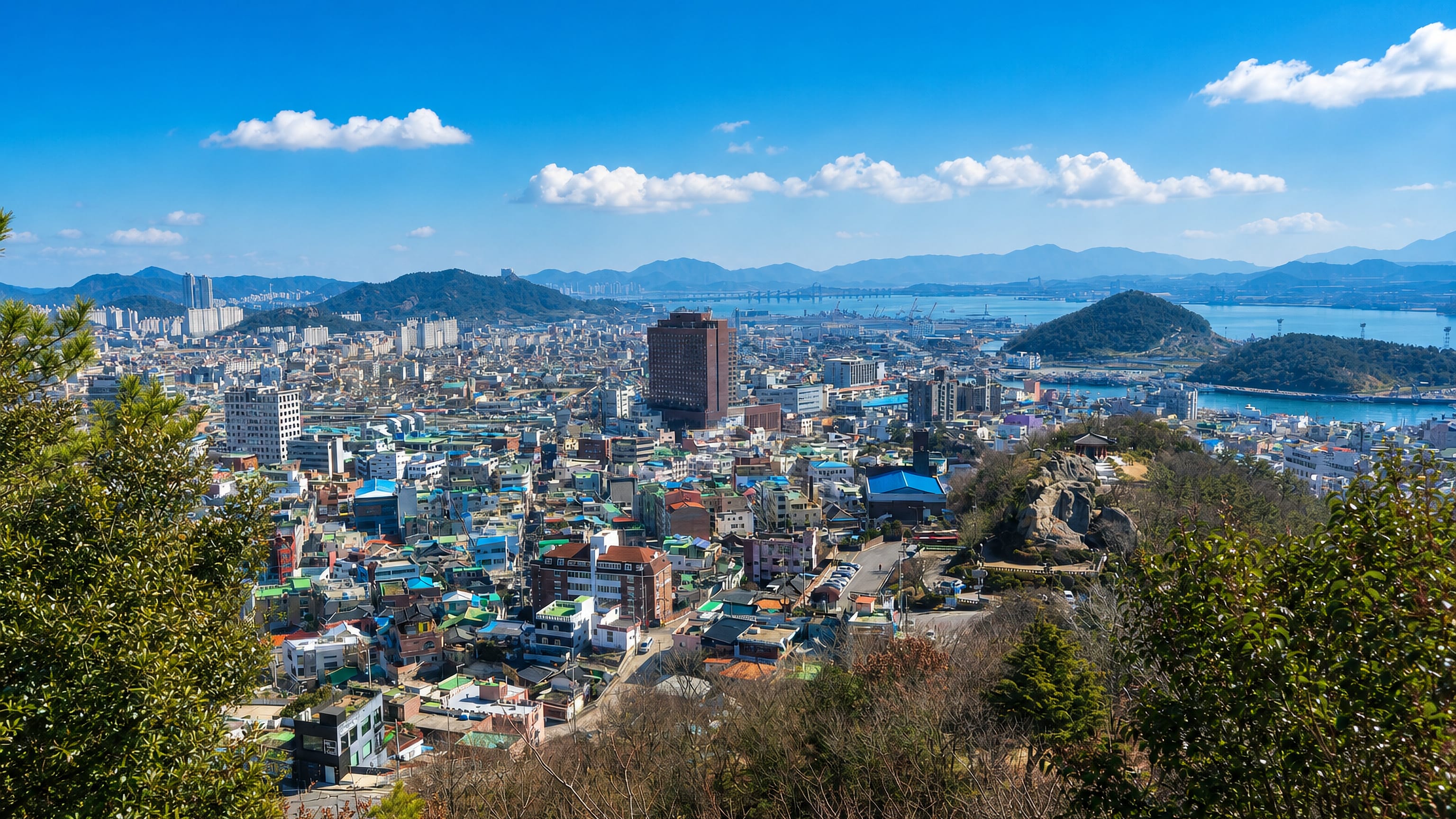 Mokpo's harbour city spreads below Yudal Mountain toward offshore islands and a long suspension bridge.