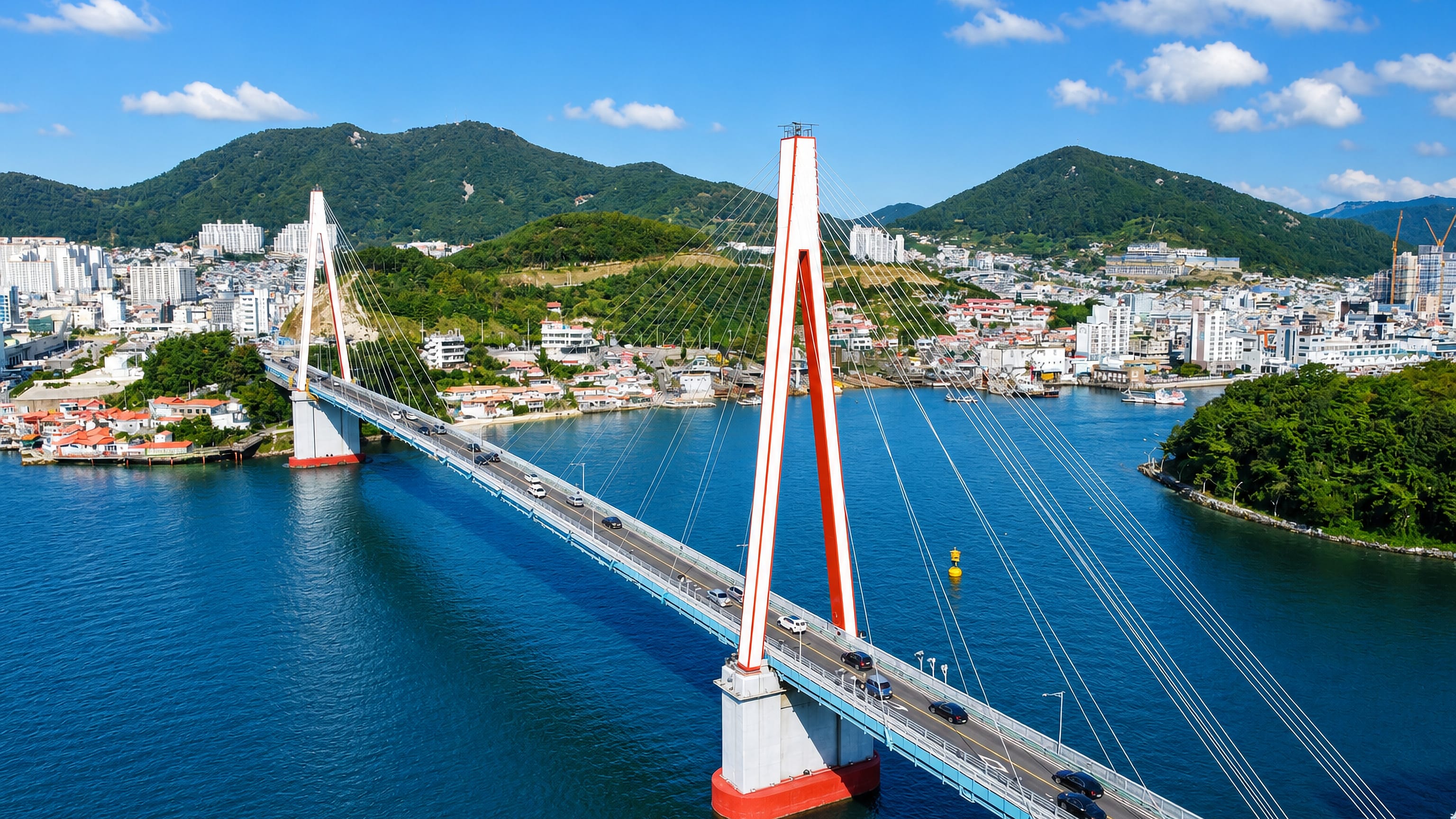 The red cable-stayed Dolsan Bridge spanning the strait to Dolsan Island at Yeosu, South Korea.