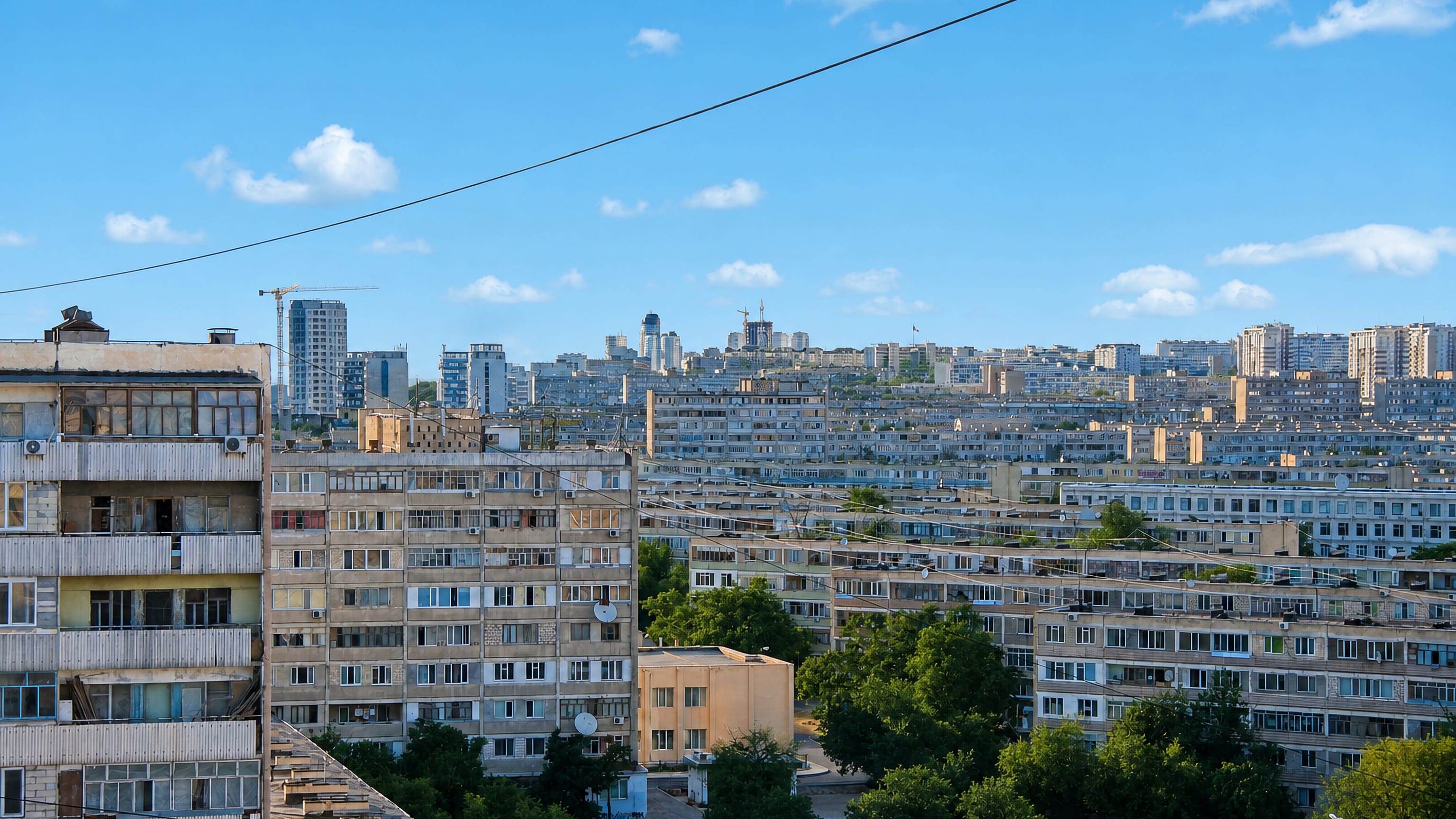 Soviet-era apartment blocks stretching across the hillside microdistricts of Aktau, Kazakhstan.