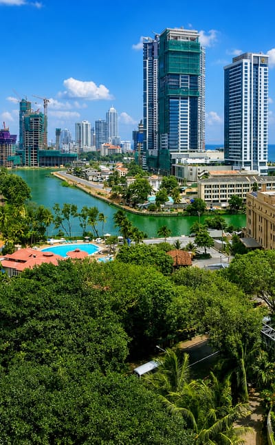 Colombo skyline of high-rise towers above Beira Lake and the Indian Ocean, Sri Lanka