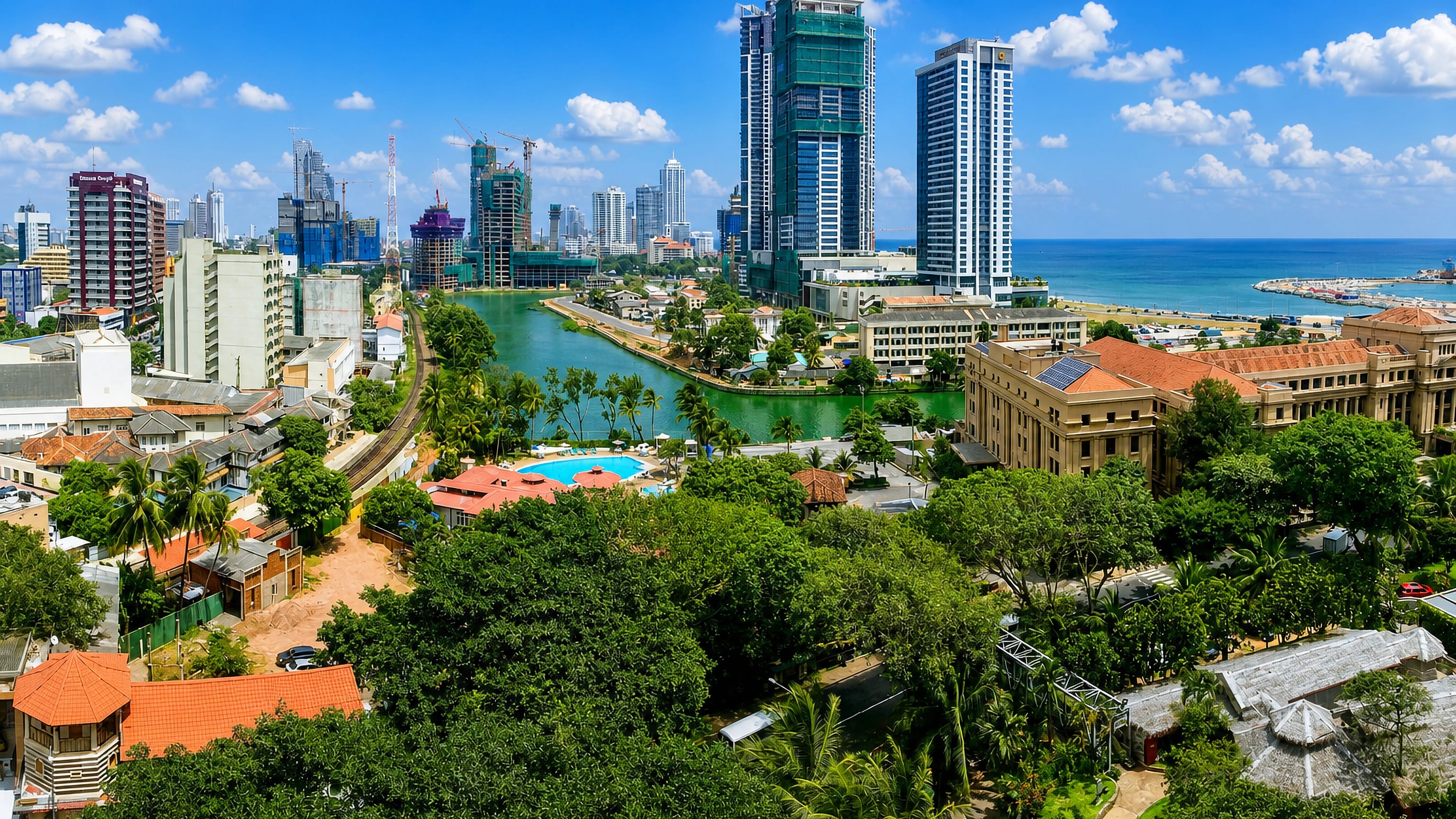 Colombo skyline of high-rise towers above Beira Lake and the Indian Ocean, Sri Lanka
