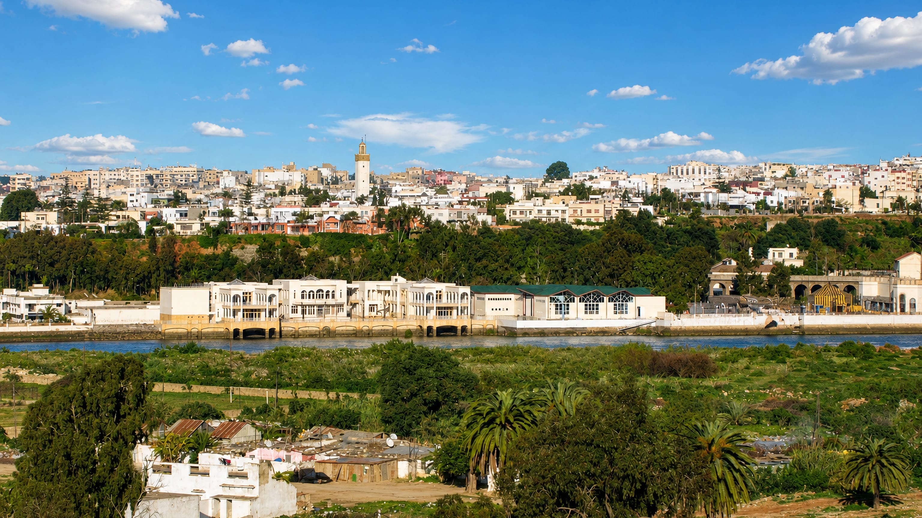 Whitewashed hillside houses and a minaret above the Bou Regreg river in Bettana, Salé.