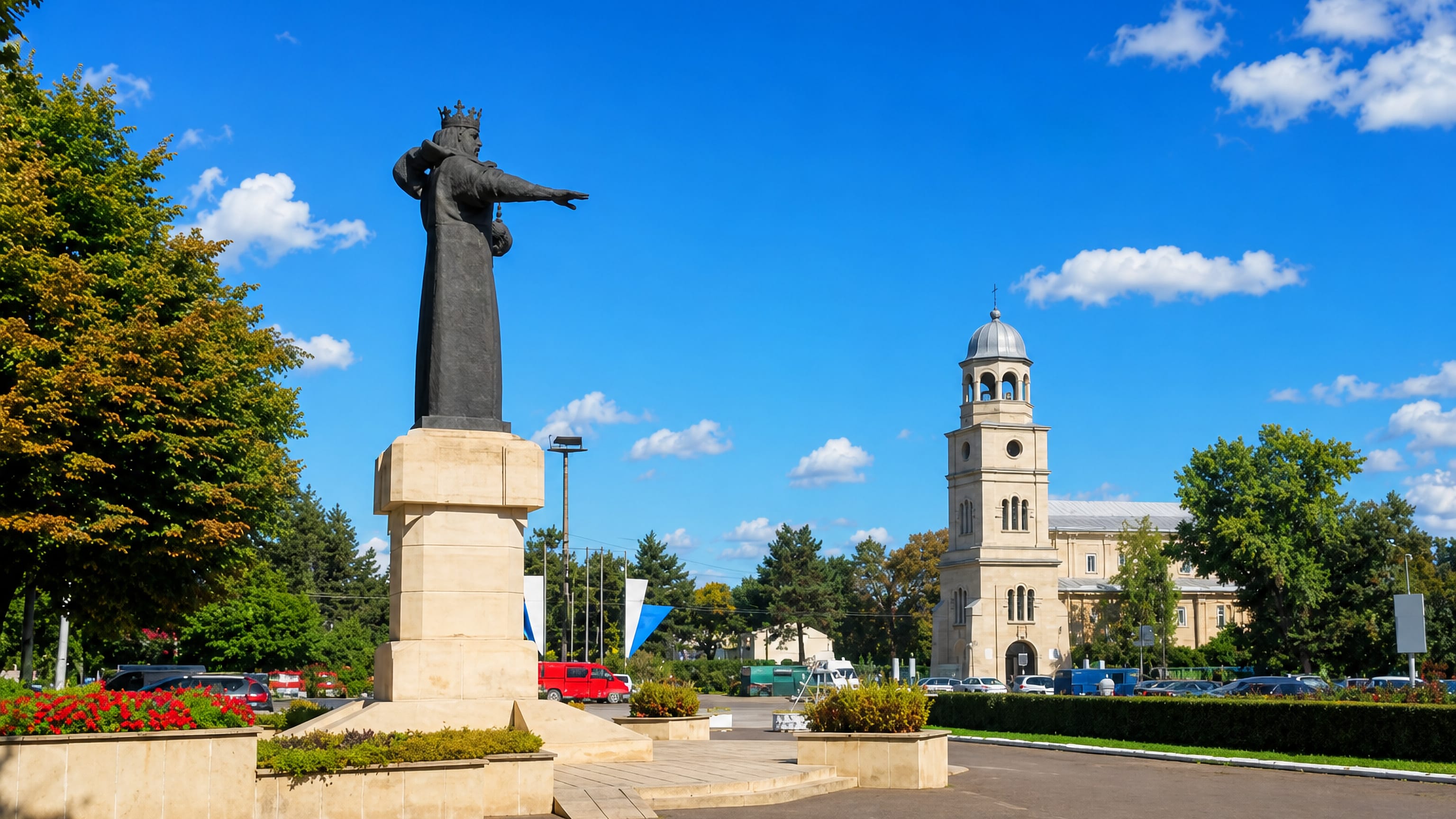 Ștefan cel Mare monument on the central square in Bălți, Moldova, with the cathedral bell tower behind