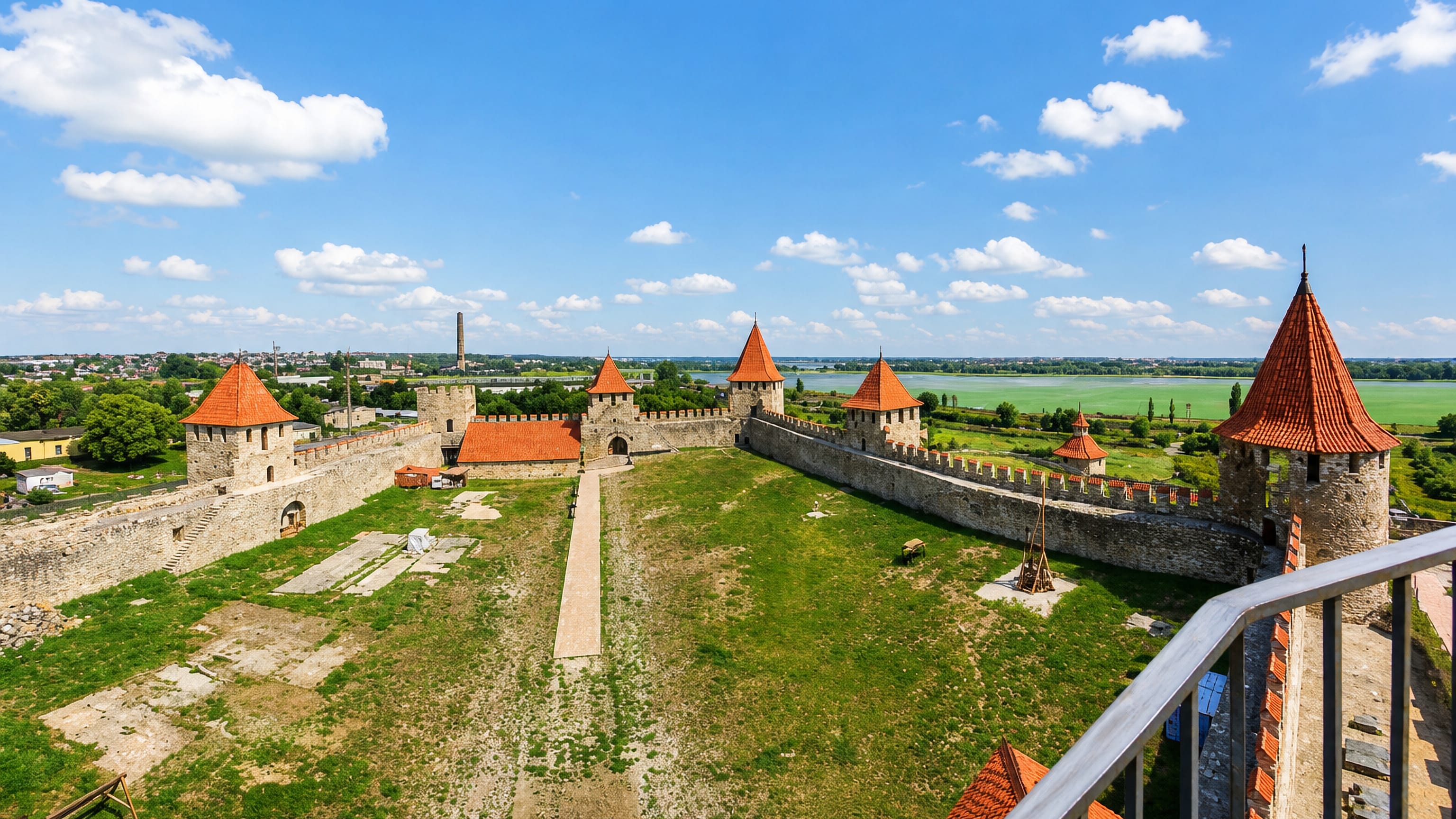 Bender Fortress on the Dniester, its red-roofed stone towers and curtain walls above the river plain, Moldova.