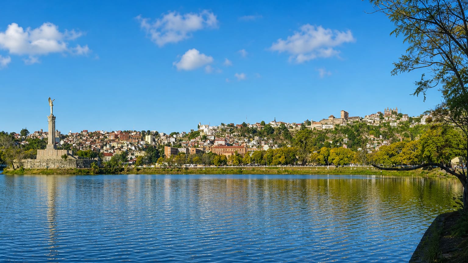 Lake Anosy in Antananarivo with its island war memorial and the hillside city topped by the royal palace