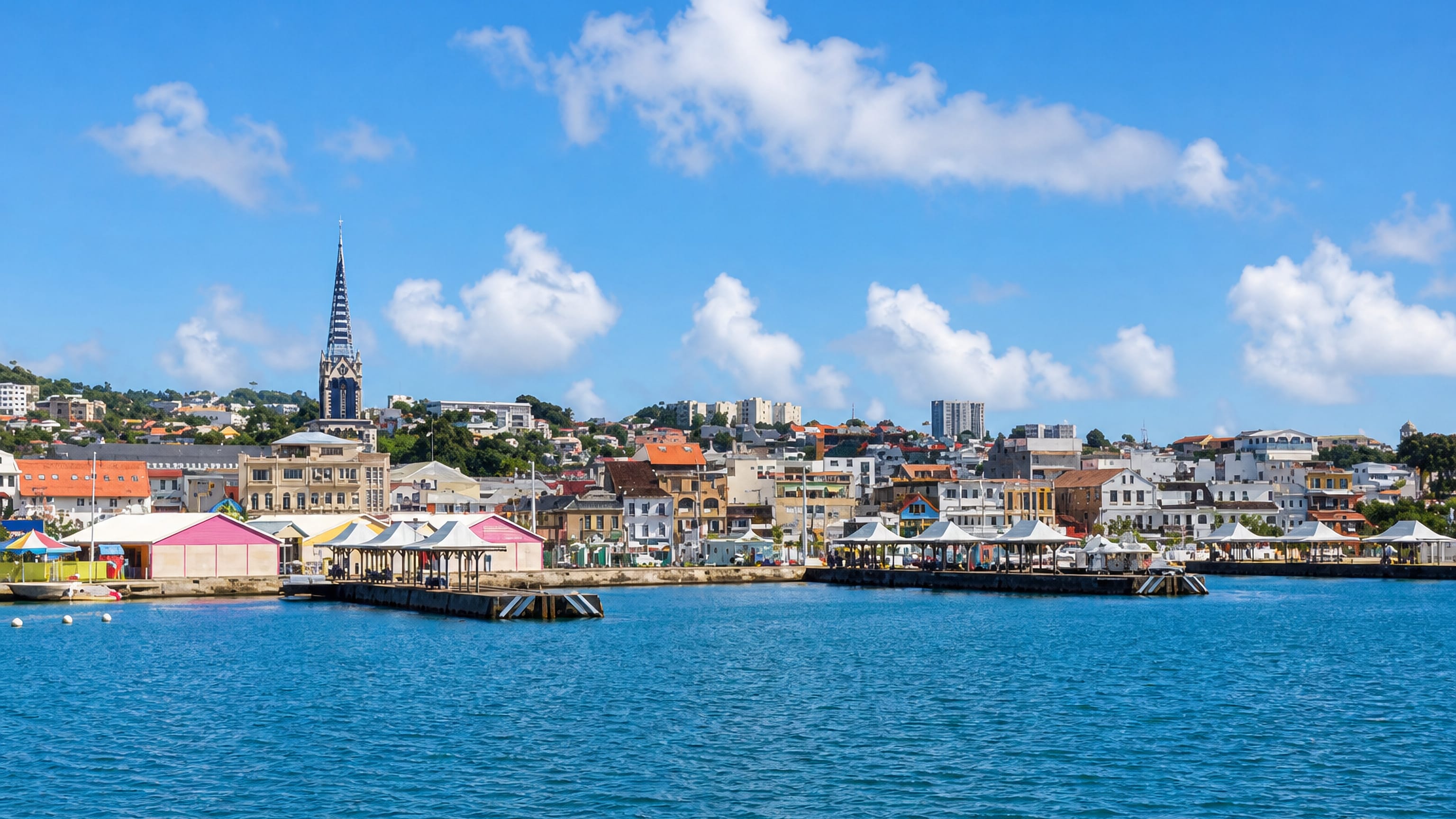 Fort-de-France, Martinique, across the bay: colourful waterfront buildings and the cathedral's tall iron spire
