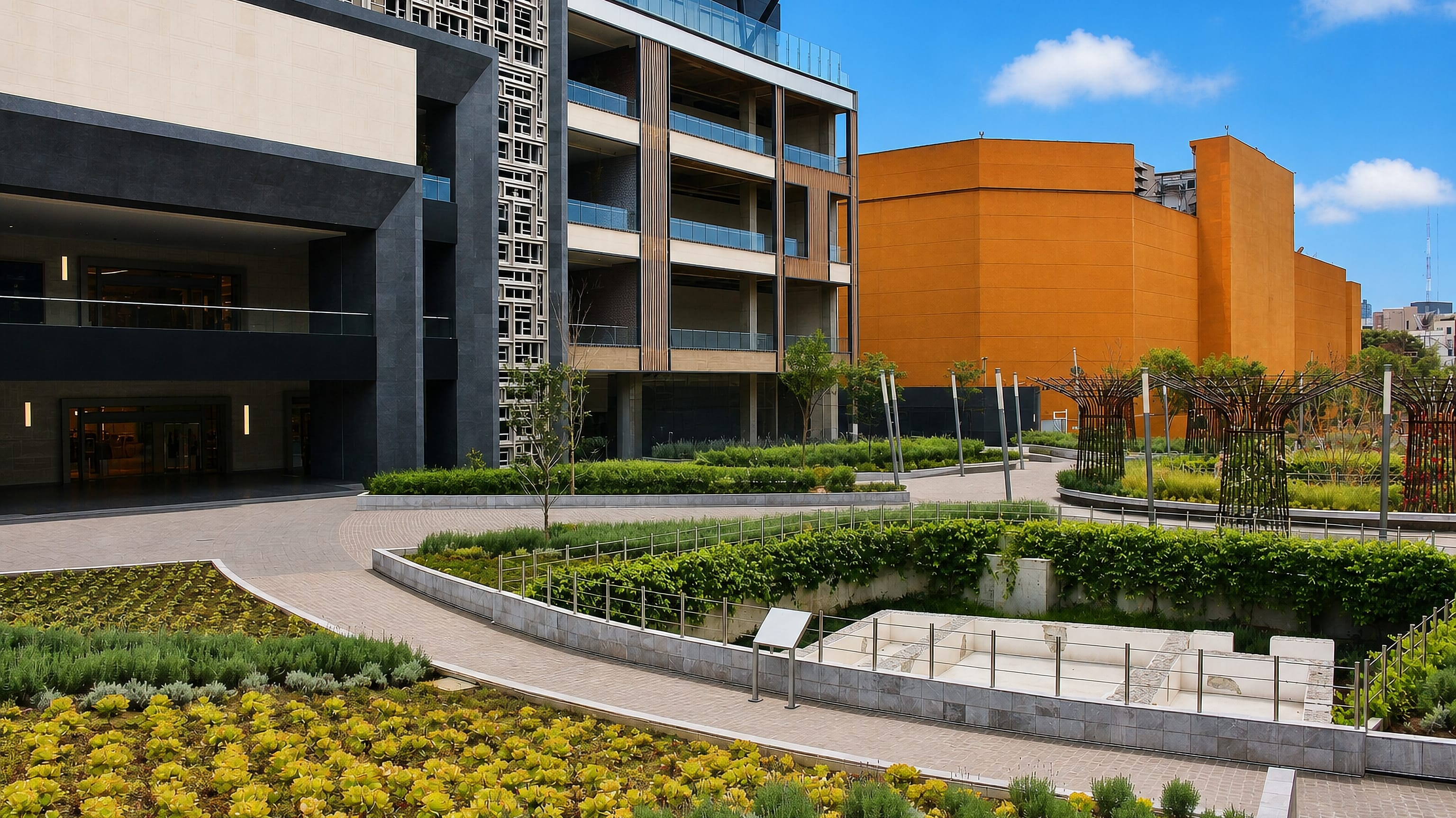Landscaped plaza gardens and modern mixed-use buildings in Benito Juárez, Mexico City.