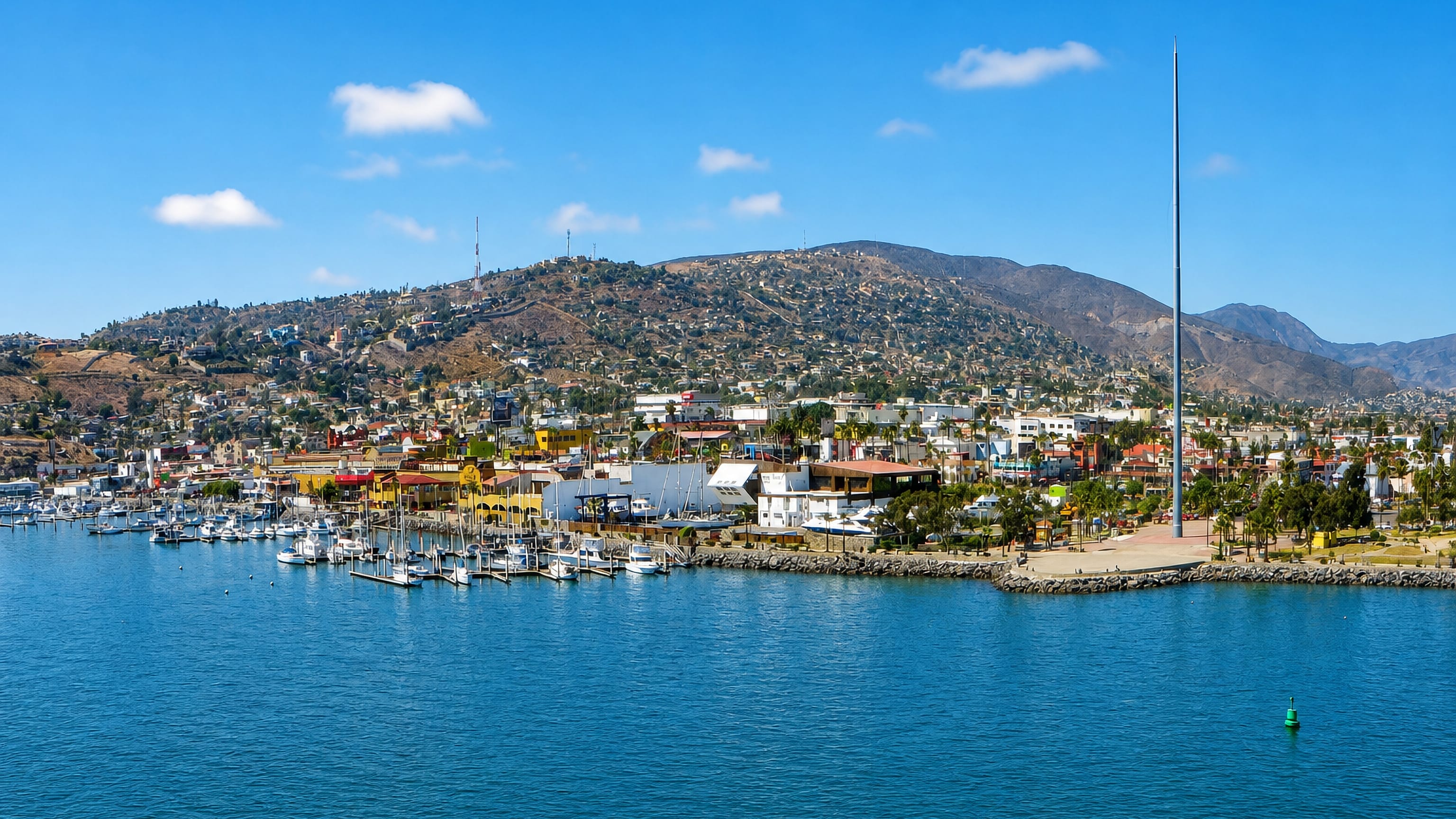 Ensenada's harbour on Bahia de Todos Santos, with marina, malecon flagpole and the Chapultepec hills.