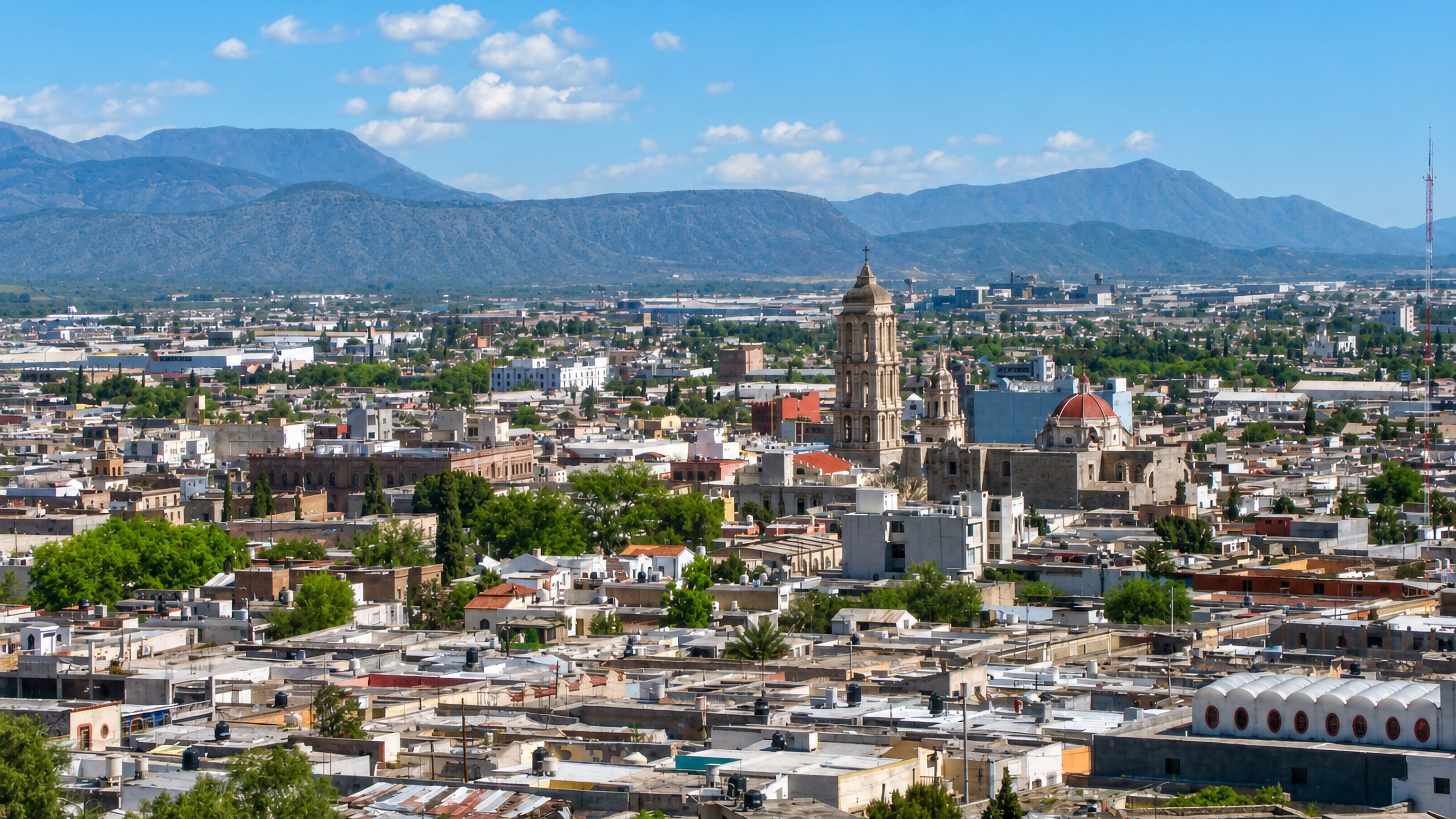 Saltillo, Mexico, spread below the Sierra Madre with the Santiago Cathedral bell tower rising over low rooftops.