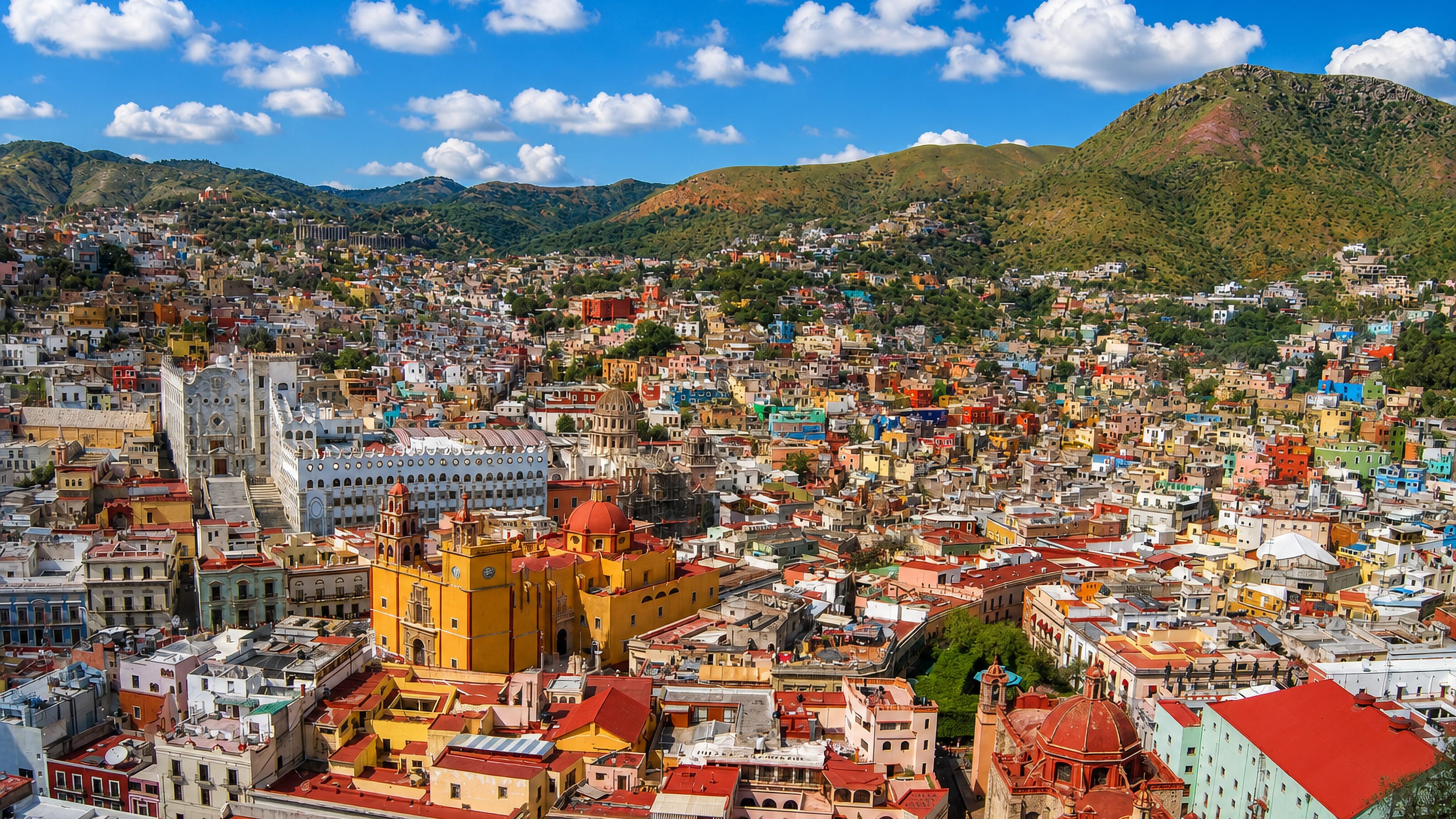 Guanajuato, Mexico, from above: the yellow basilica, the university's stepped facade and colourful houses on the hills.