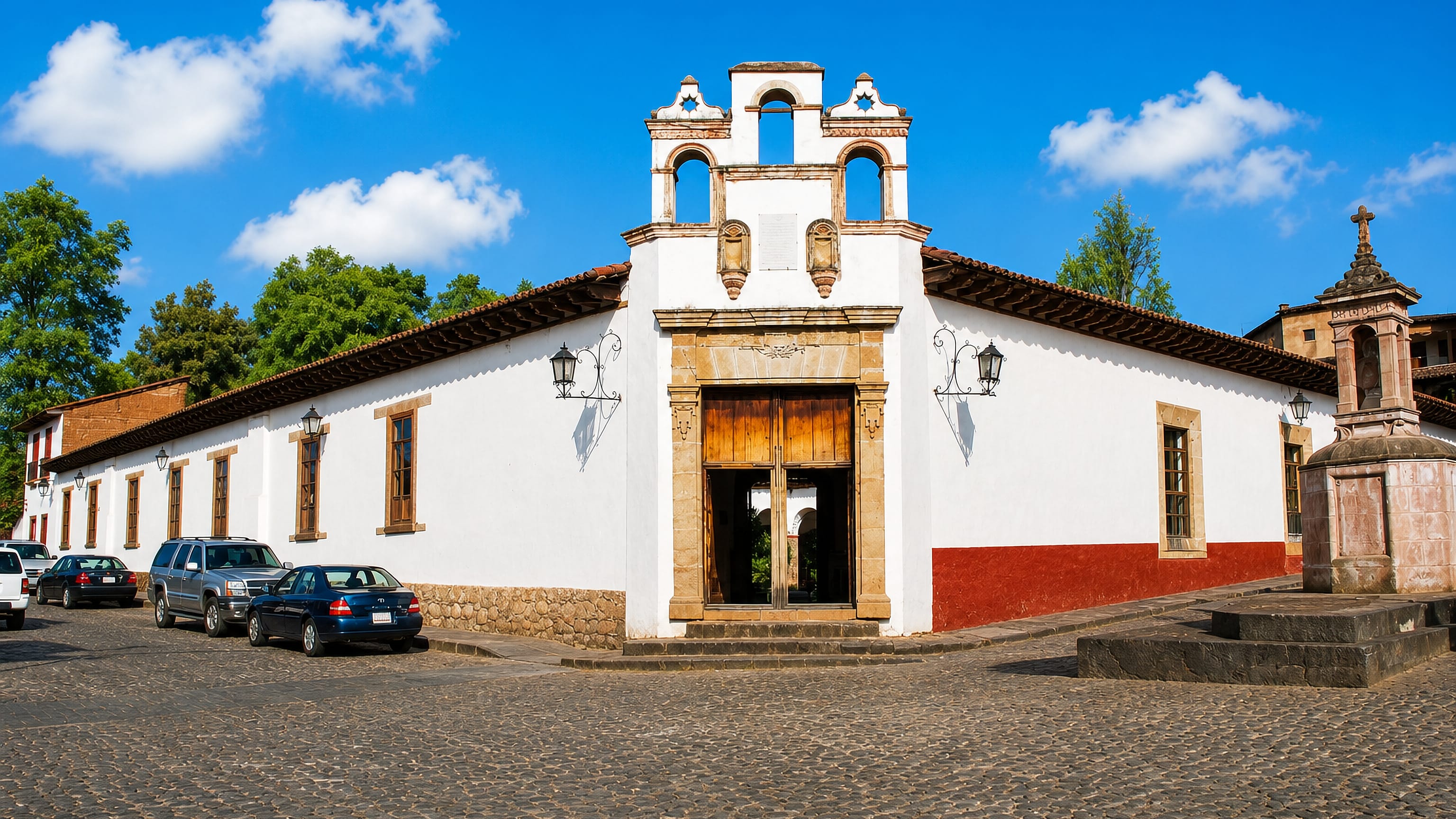Whitewashed colonial building with a bell gable on a cobbled street in Pátzcuaro, Michoacán