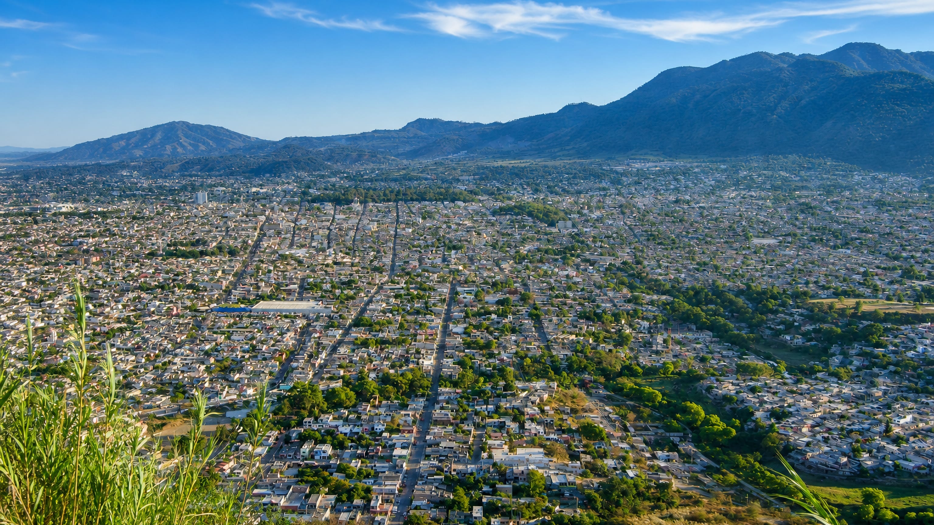 Hillside overlook of Tepic, Nayarit, its street grid filling the valley below forested sierra ridges
