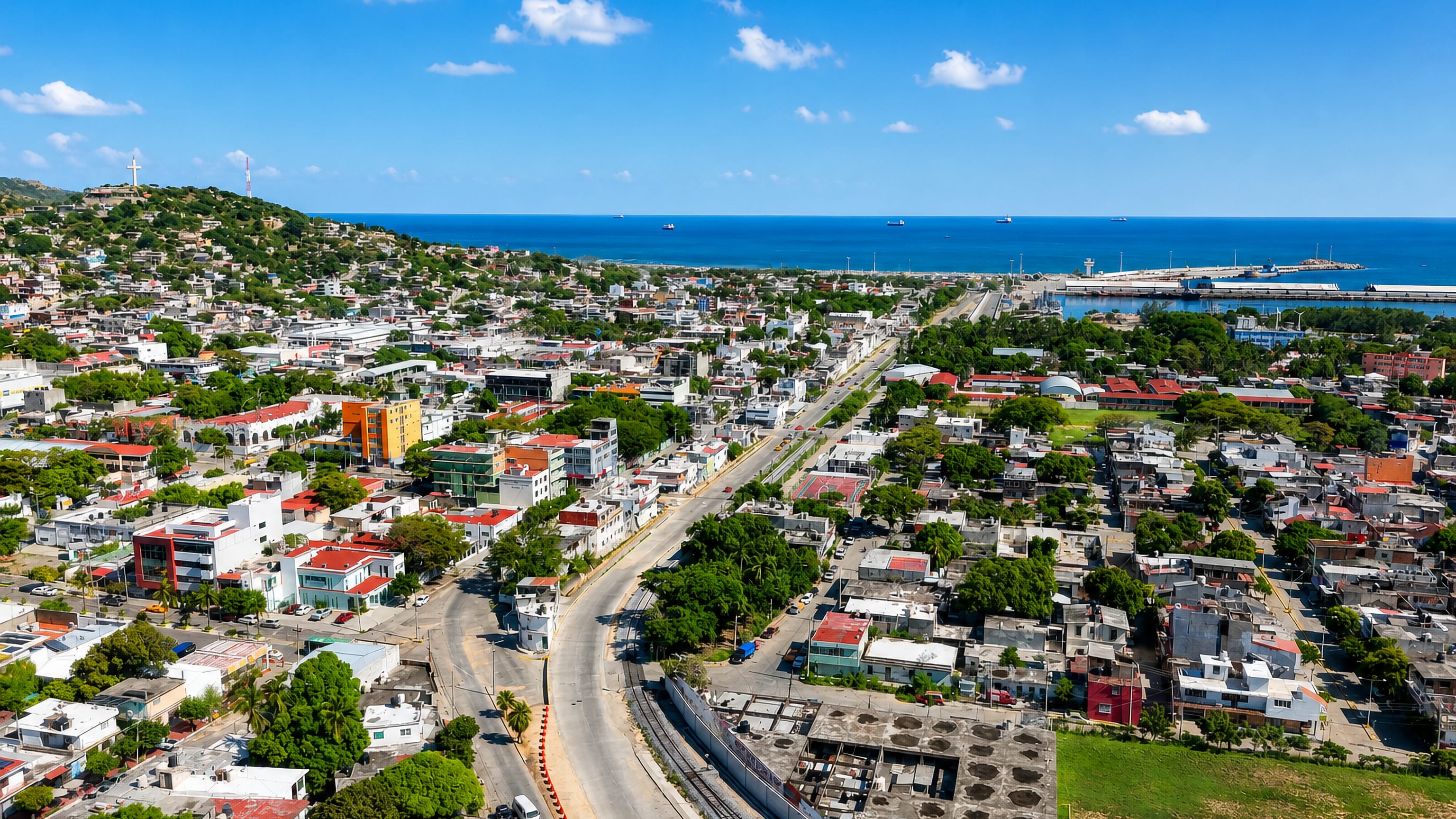 Salina Cruz, Oaxaca, from above: hillside neighbourhoods, the main avenue and the Pacific port beyond.