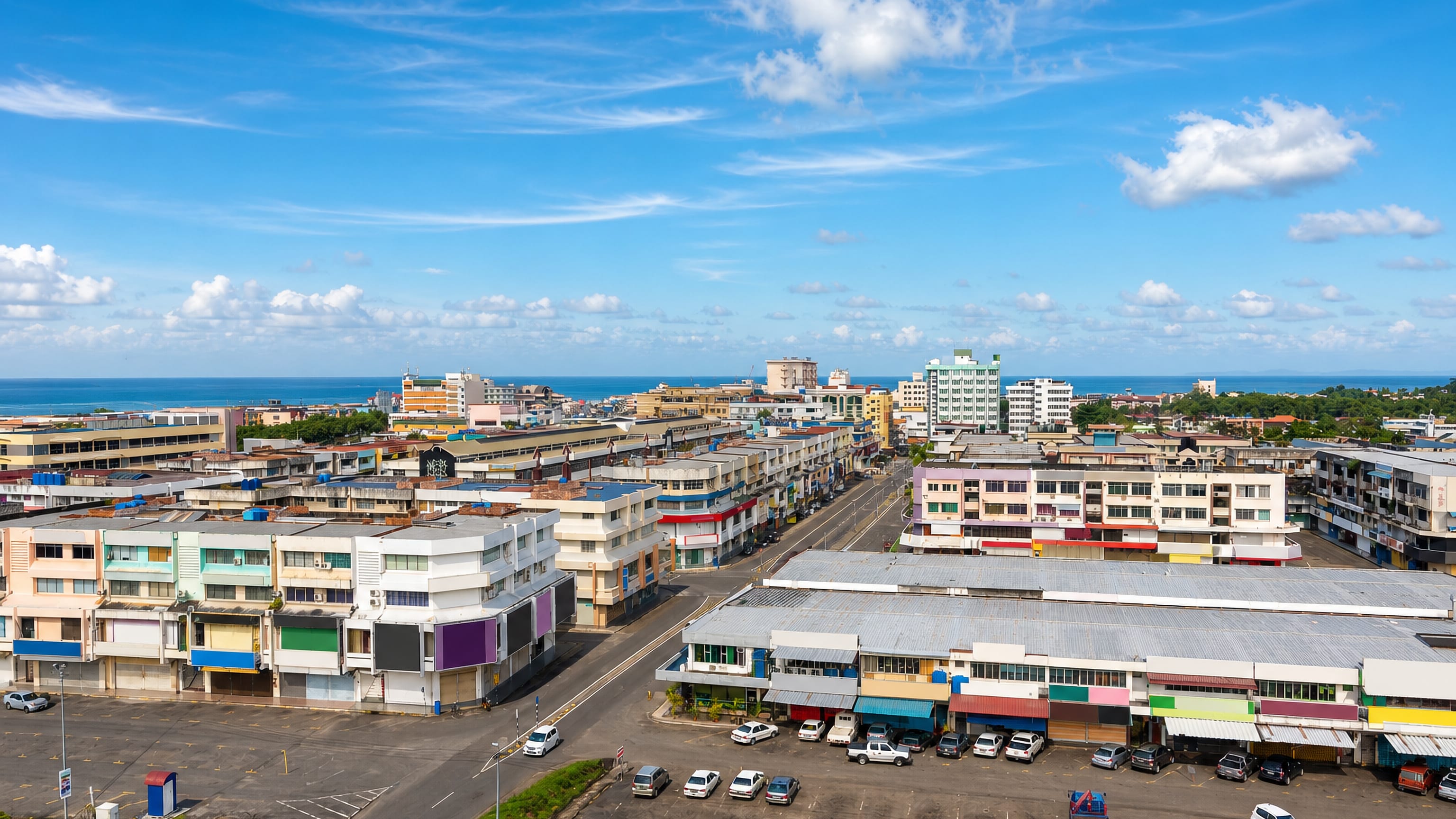 Rows of colourful shophouses and a seafront skyline in central Tawau, Sabah, Malaysia