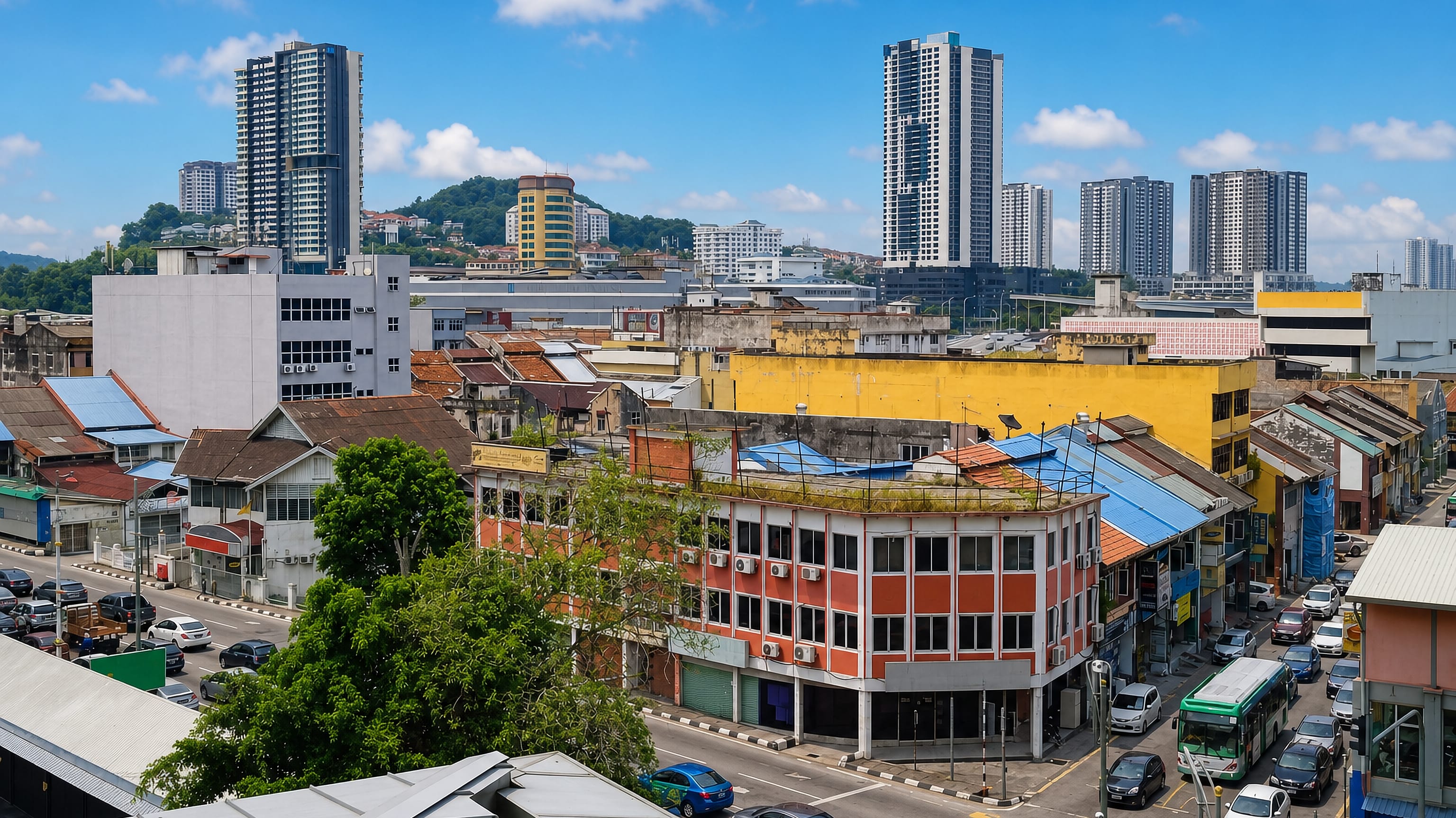 Kajang town centre in Selangor, with old shophouses and busy streets below high-rise condominium towers.