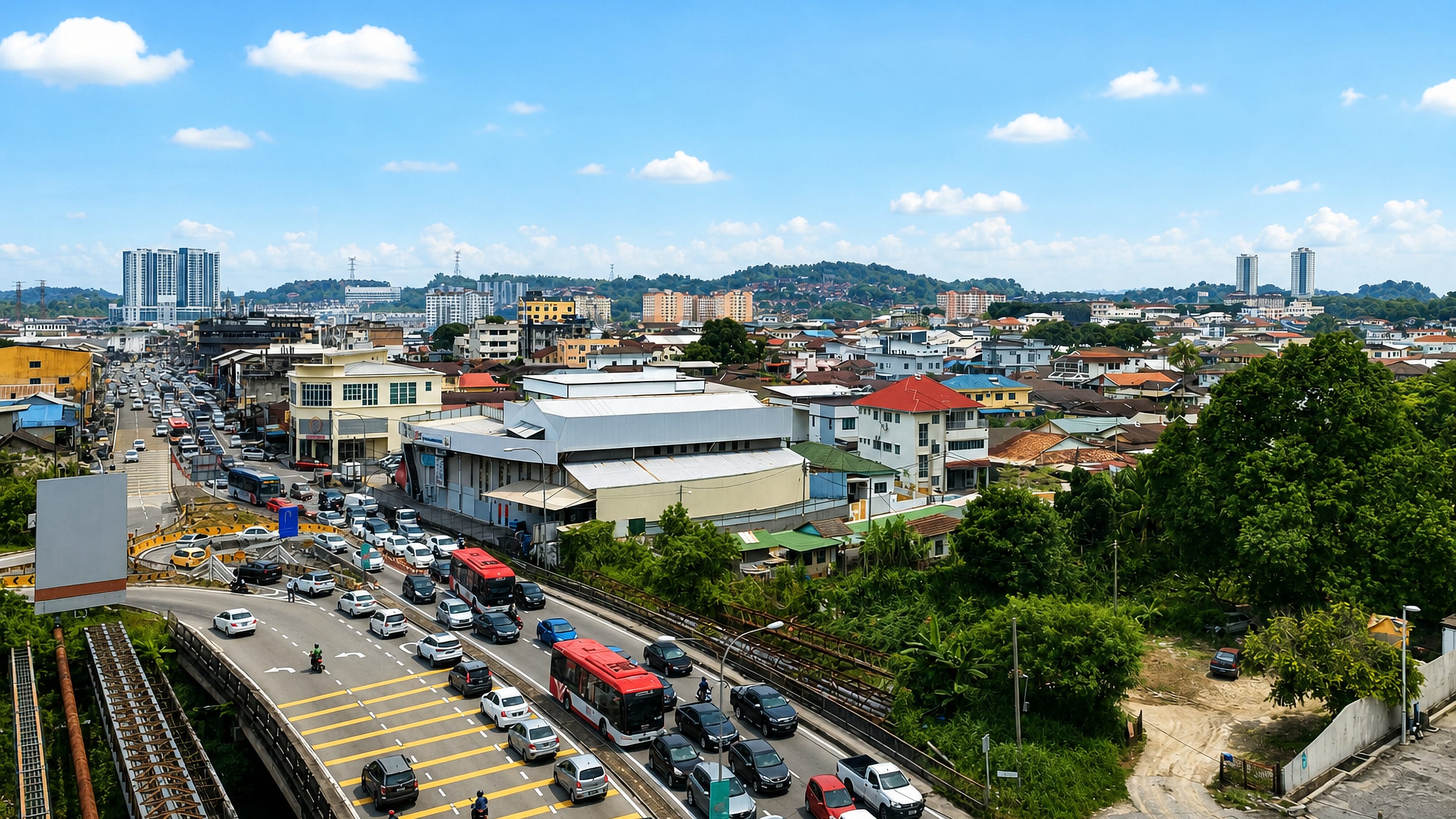 Elevated view of Seri Kembangan, Selangor, with highway traffic and shophouses backed by wooded hills