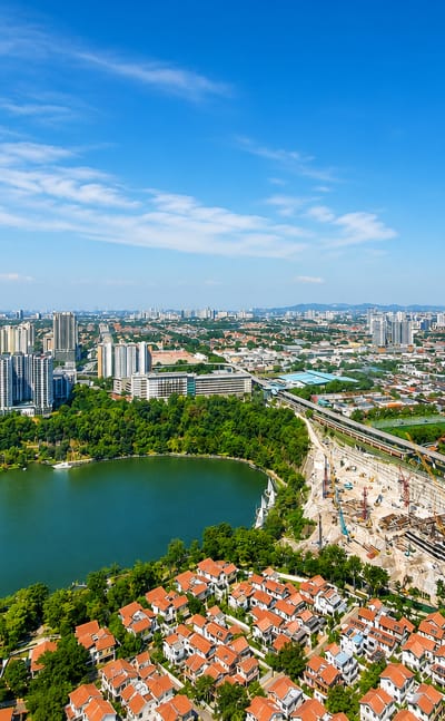 Aerial view of Bandar Sunway, Petaling Jaya, with its lake park, high-rise condominiums and transit line.