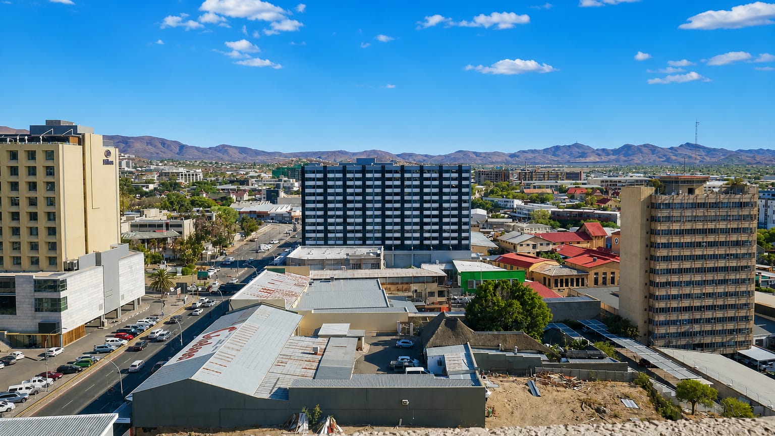 Windhoek's low-rise downtown set against the arid Khomas Highland mountains under a clear sky