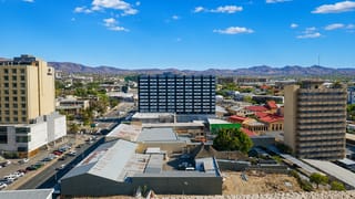Windhoek's low-rise downtown set against the arid Khomas Highland mountains under a clear sky