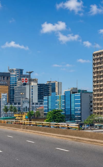 Wide avenue running past the high-rise office towers of Lagos Island's central business district