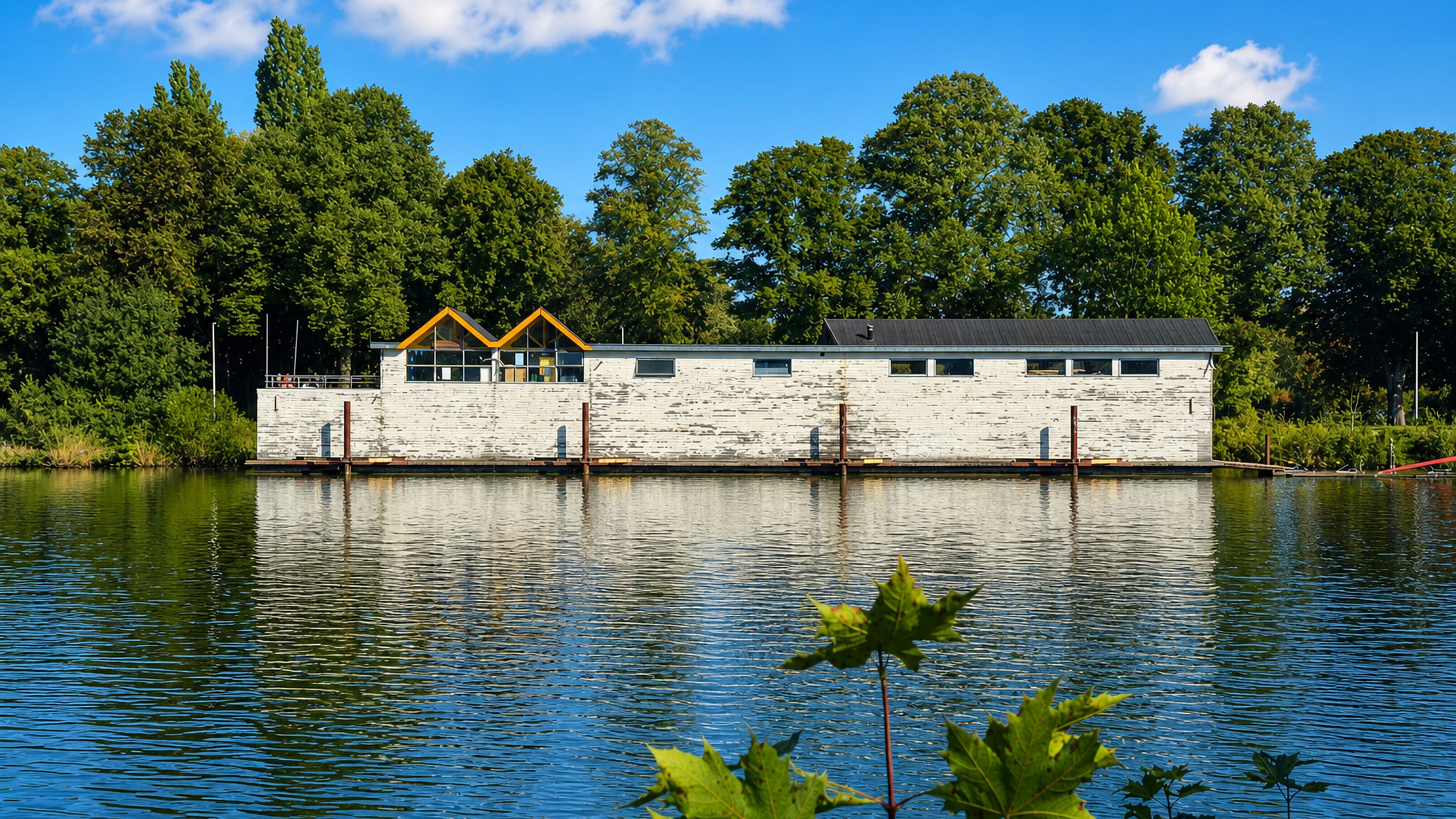 Waterside clubhouse reflected in a lake at Hatert, a residential district on the edge of Nijmegen.