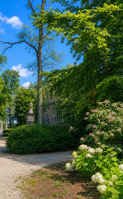Tree-lined gravel drive, gate piers and hydrangeas in the Crabbehof estate grounds, Dordrecht