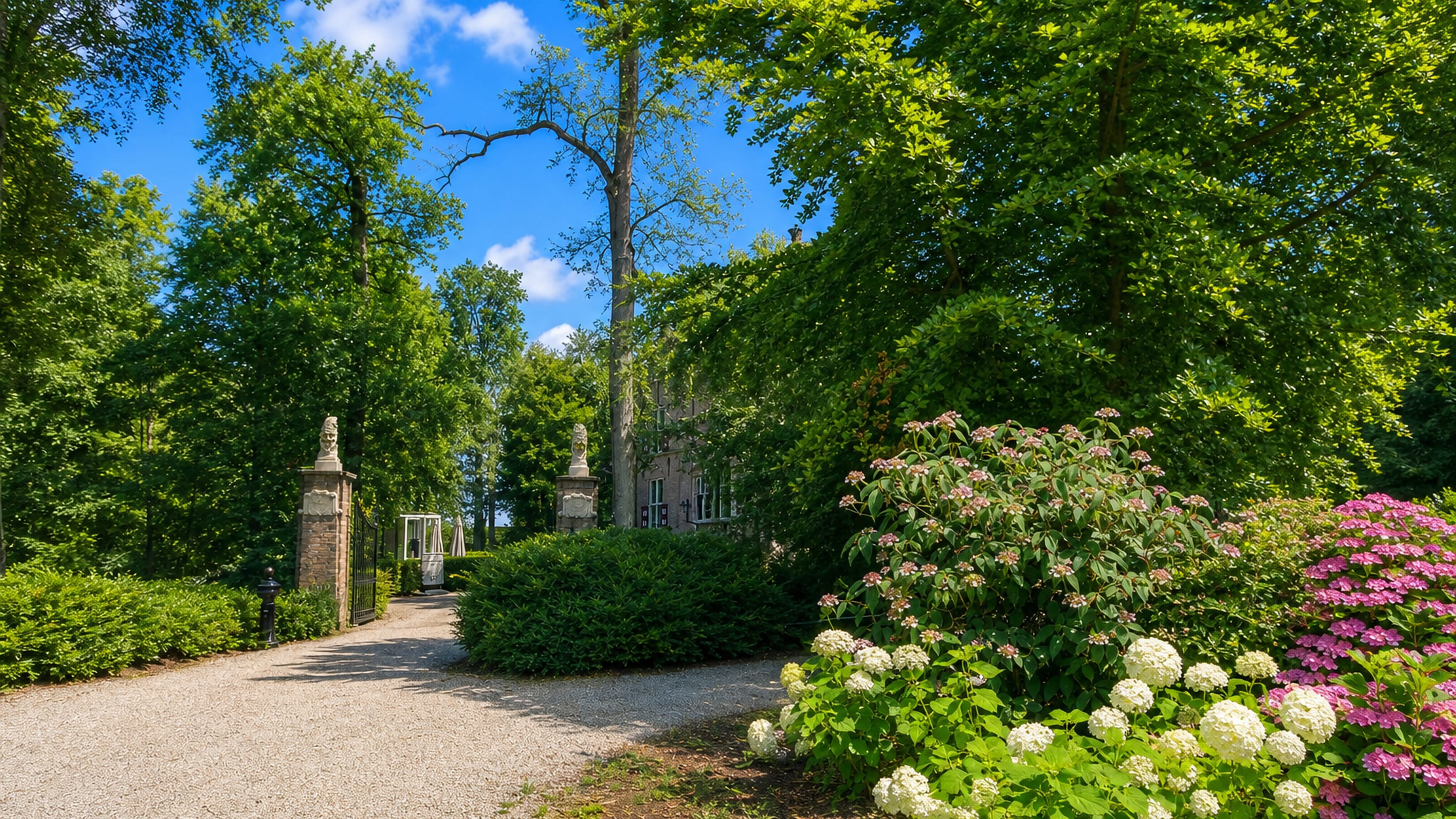 Tree-lined gravel drive, gate piers and hydrangeas in the Crabbehof estate grounds, Dordrecht
