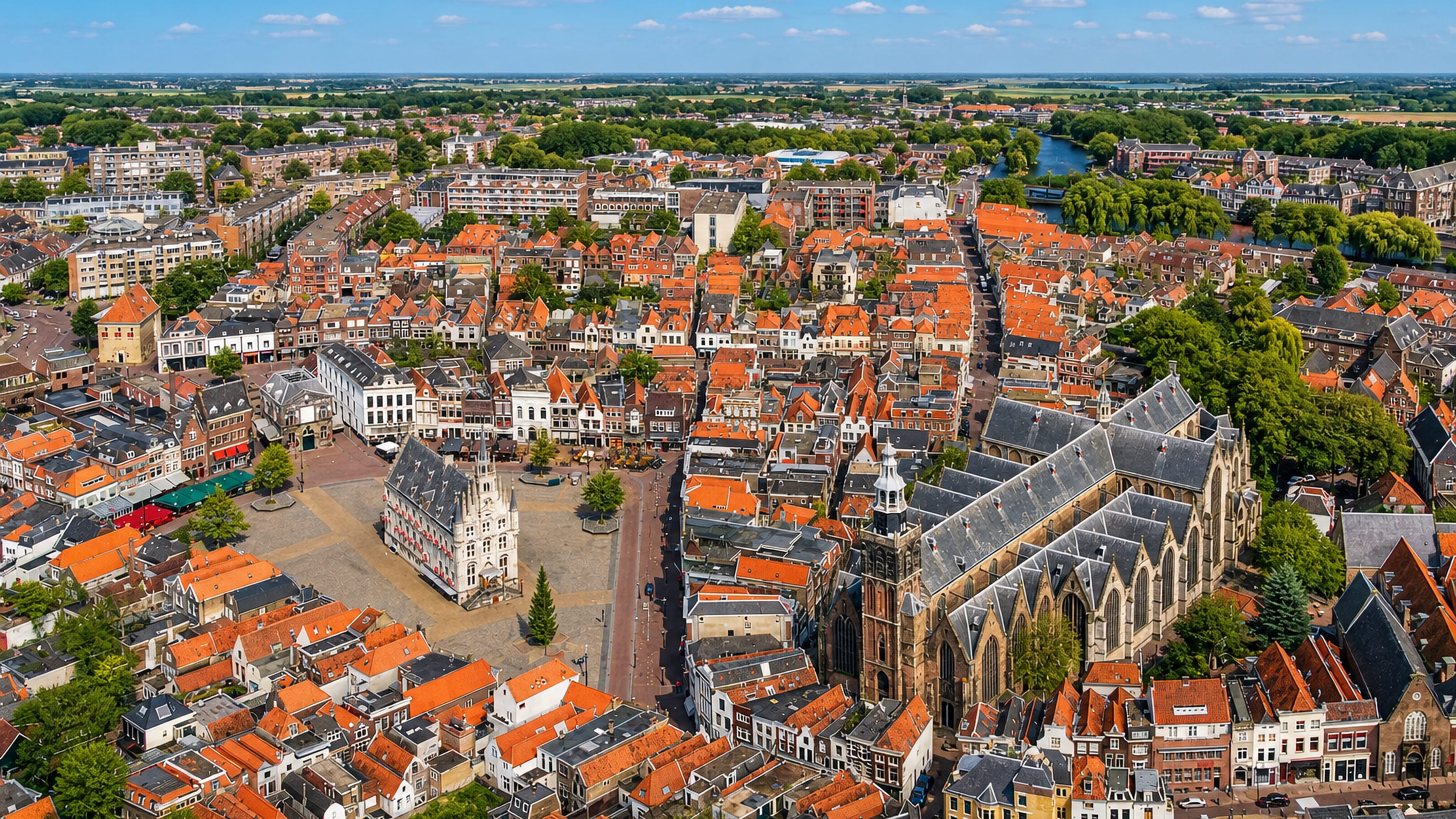 Aerial view of Gouda's Markt with its freestanding Gothic city hall and the long Sint-Janskerk, Netherlands