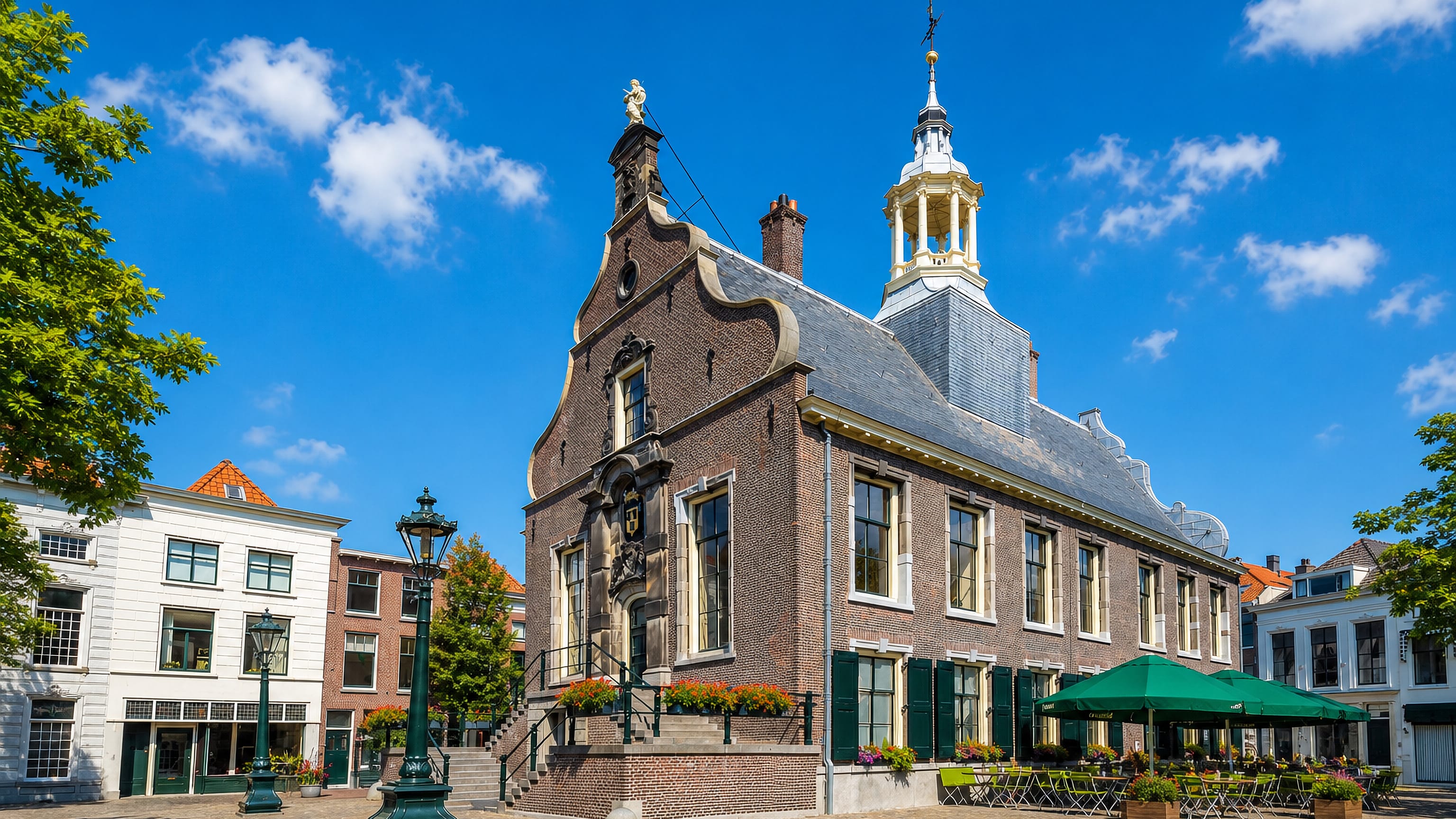 The historic town hall with its gilded cupola on the cobbled Grote Markt in Schiedam, Netherlands.