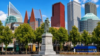 Het Plein square in The Hague with the William of Orange statue and the city's high-rise skyline behind