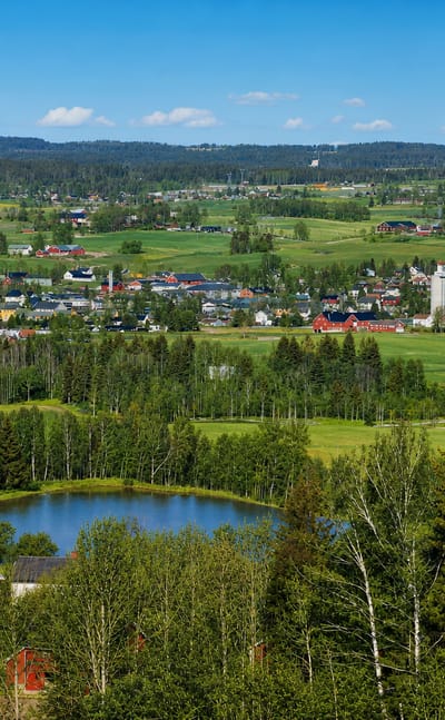 Elevated summer view over Lena, Norway, a small town amid the farmland and forests of Toten.