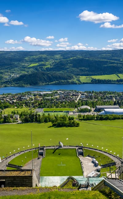 Elevated view over Lillehammer, Lake Mjosa and the Olympic ski-jump stadium in the foreground, Norway