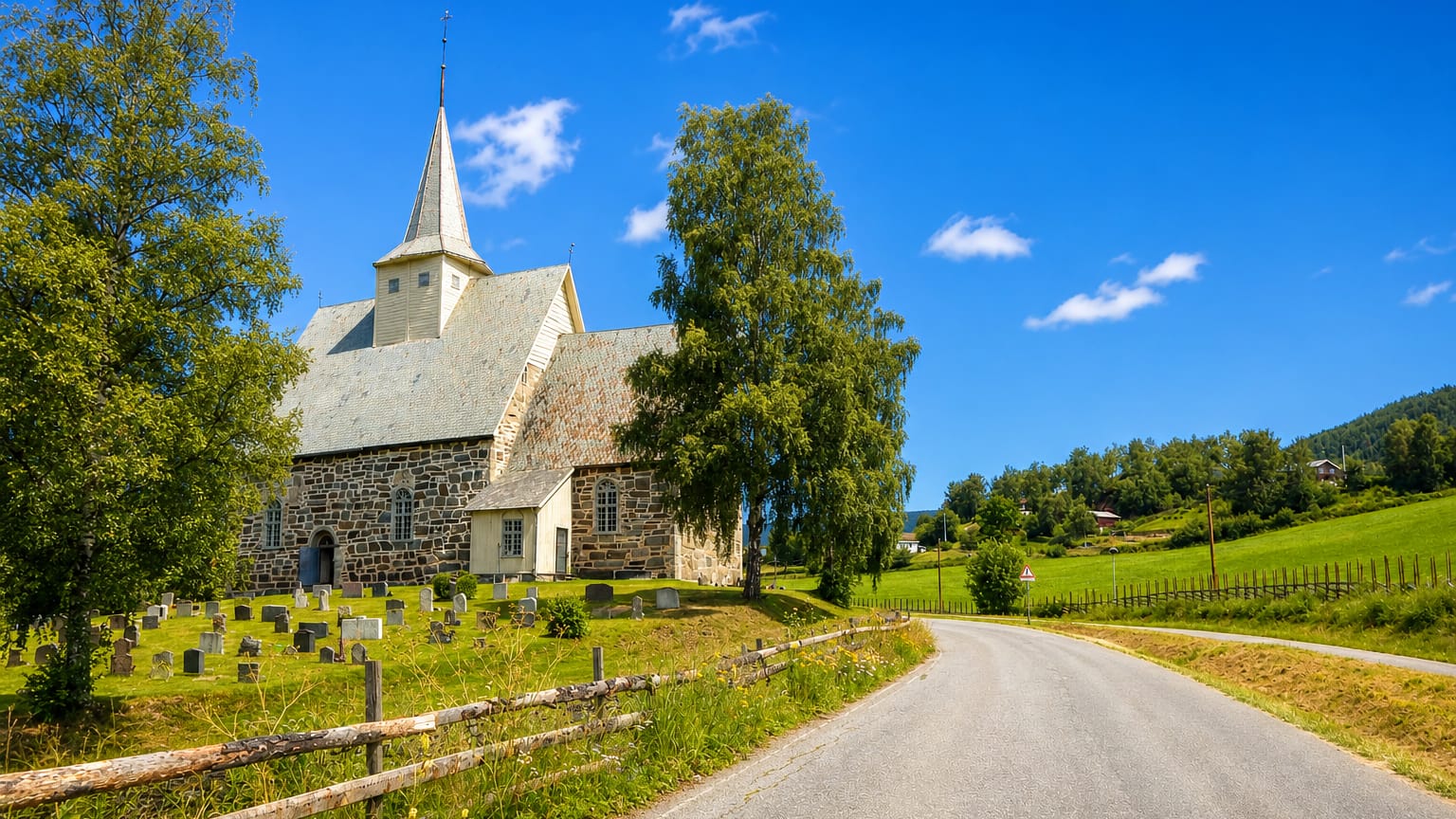 Medieval stone church and churchyard at Slidre beside a country lane amid green fields and birch trees