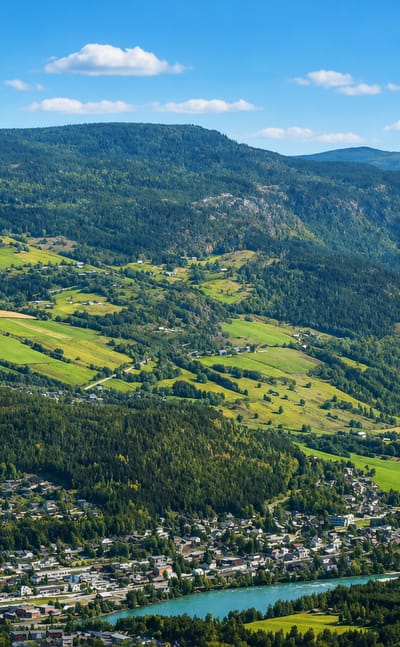 Aerial view of Vinstra, Norway, in the Gudbrandsdalen valley beside its river and green farmland