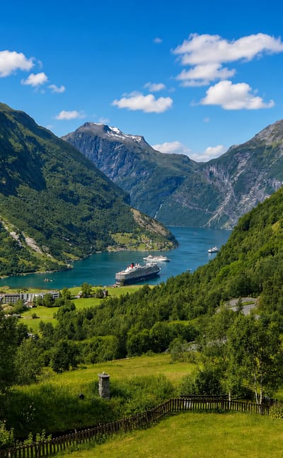 Geirangerfjord in Norway with a cruise ship on the turquoise water framed by steep green mountains and the village of Geiranger.