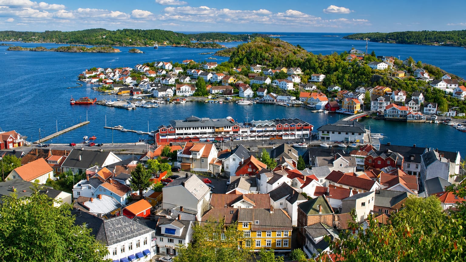 Panoramic view over Kragerø's white timber houses, harbour and archipelago islands on the Telemark coast, Norway.